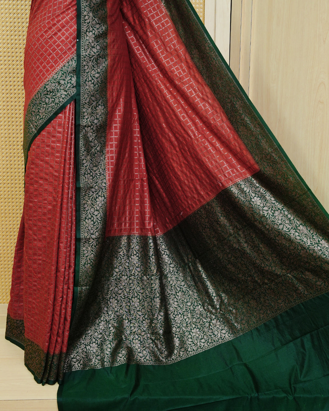 Brick brown Colour Semi georgette Saree having zari dotted check pattern on body, contrast dark forest green colour floral kodi designed Border, Rich Pallu comes with Matching Blouse piece.
