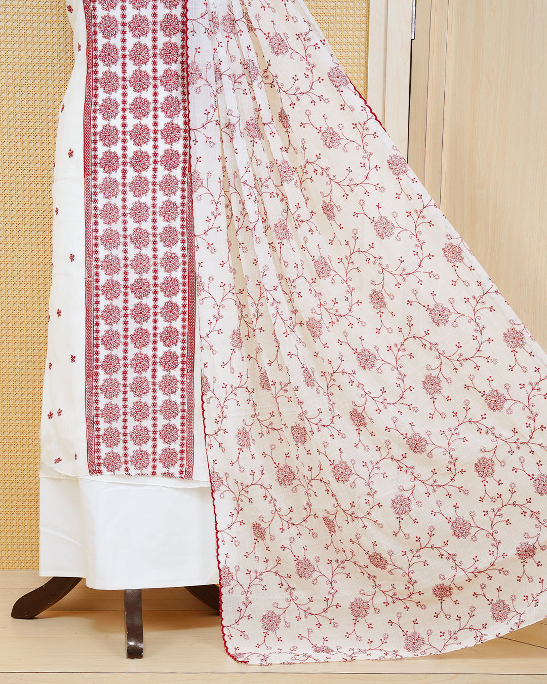 White colour Georgette Salwar material Featuring Gold zari floral motifs on body, paired with matching bottom & Elegant Dupatta