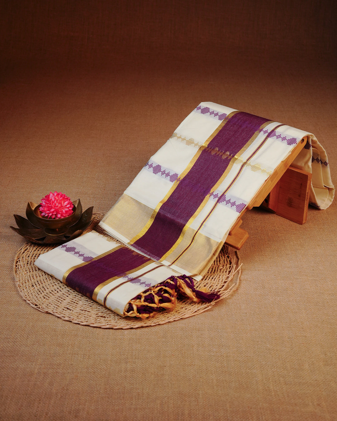 Cream colour cotton set mundu featuring Gold & Purple Strips on body, featuring Classic Purple & gold Kasav kara.