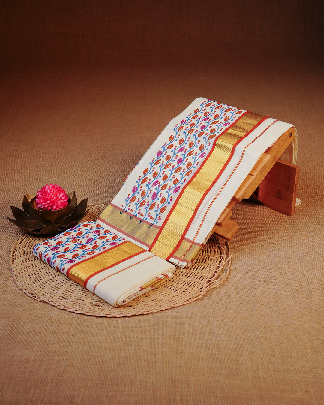 Cream colour cotton set mundu Featuring Plain, complemented by Multicolour kodi pattern With Gold & Brick colour border.
