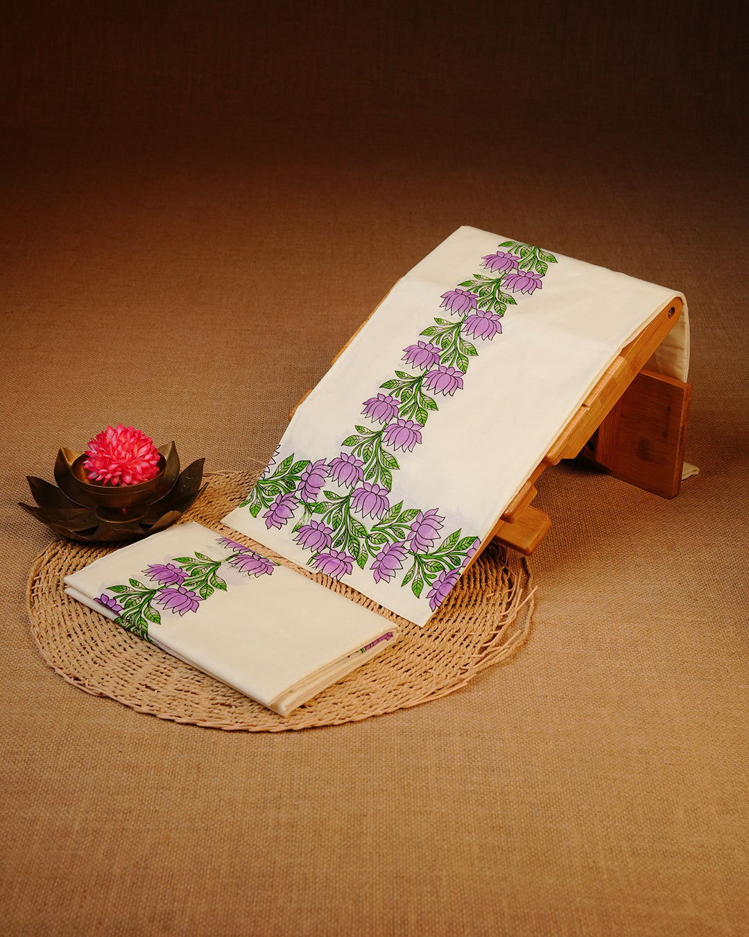 Cream colour cotton set mundu Featuring Elegant plain body, complemented by Lotus flower print kara.