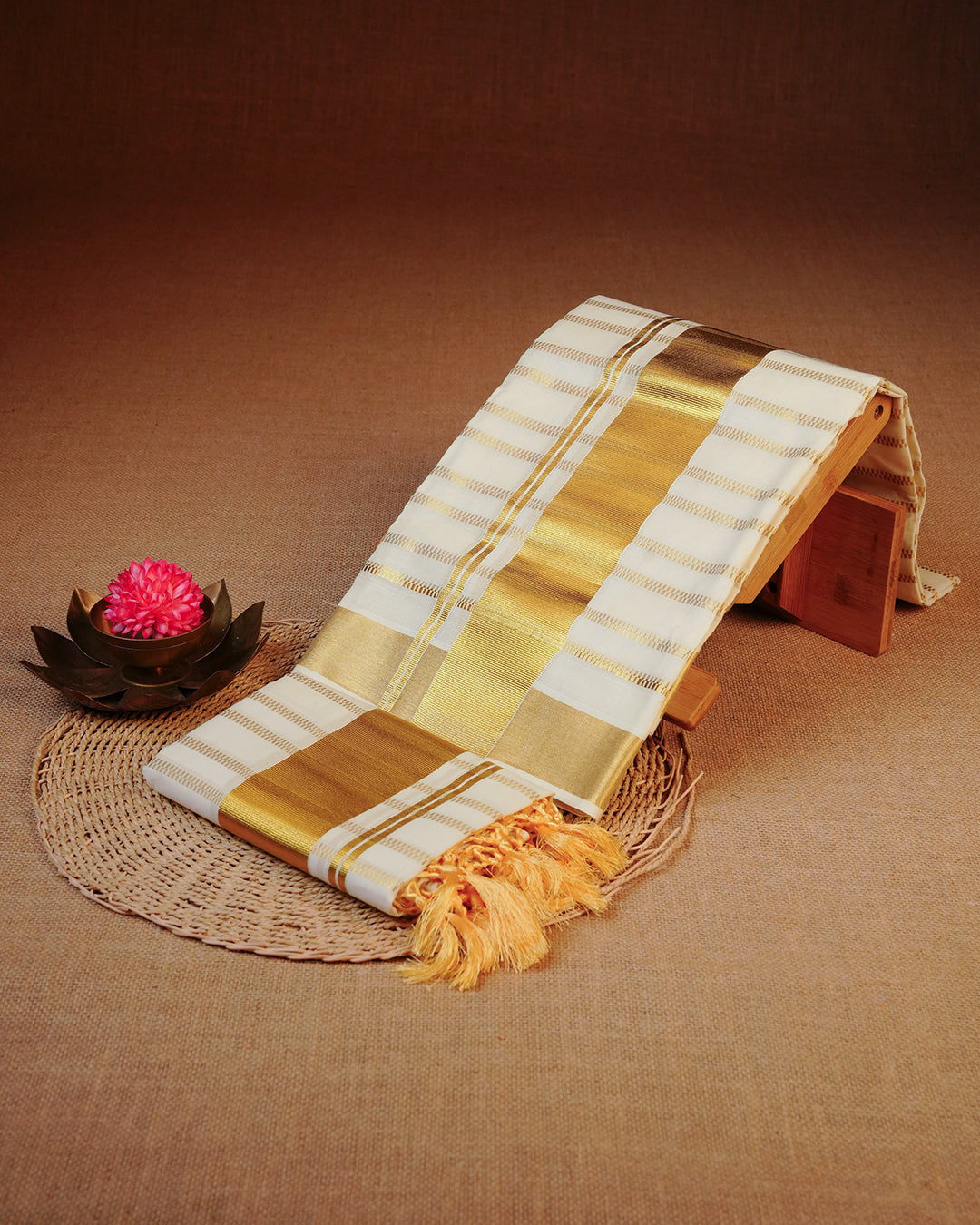 Cream colour cotton set mundu Featuring Gold zari Checks on body, complemented by classy golden with Floral print kara.