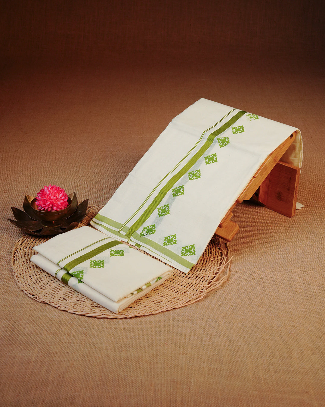 Cream colour cotton set mundu Featuring Elegant plain body, complemented by green colour kara.