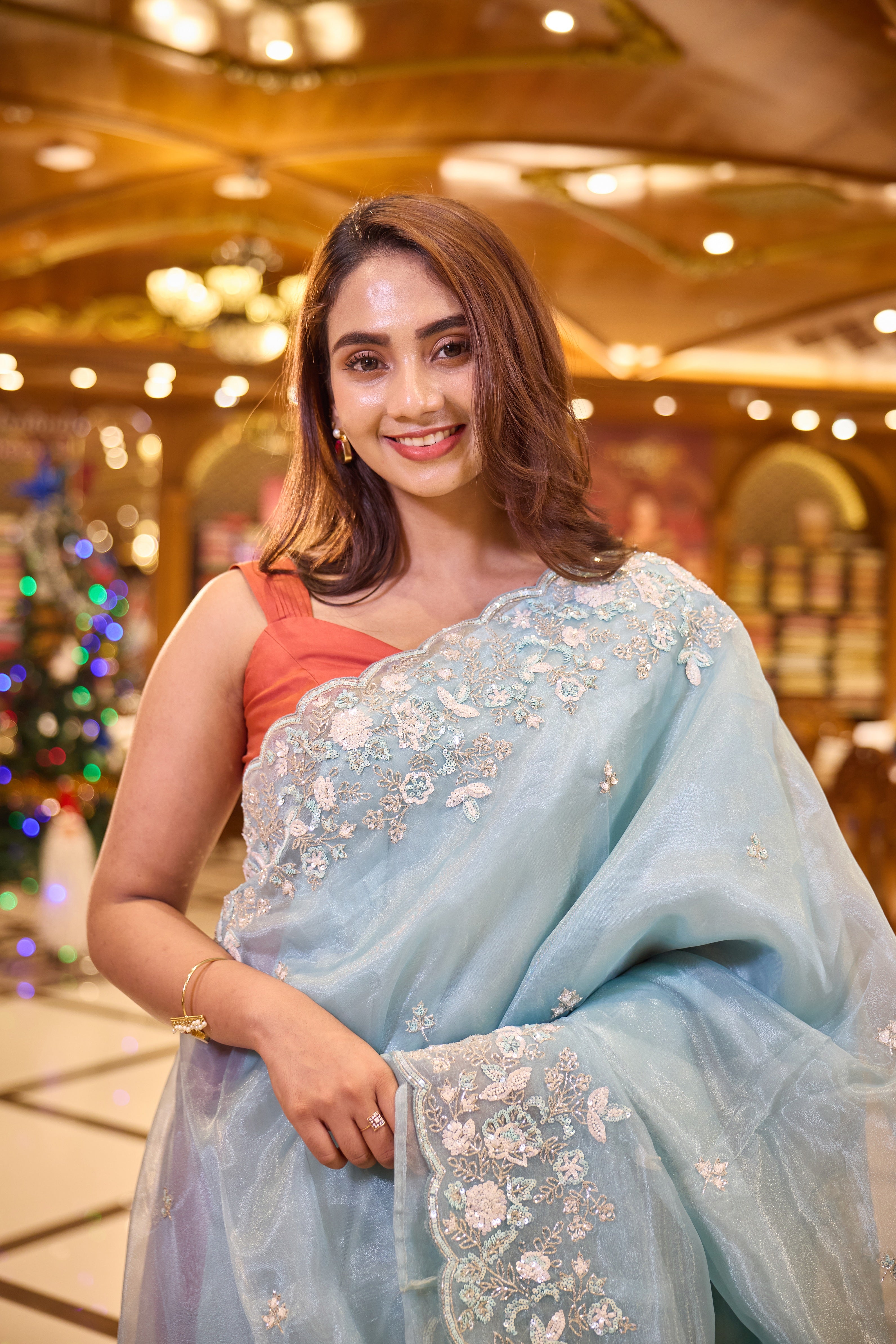 Light Blue colour Premium Designer saree crafted in fine glass organza with exquisite hand embroidered bead and sequin work, finished with an elegant scallop border, Comes with a matching worked blouse.