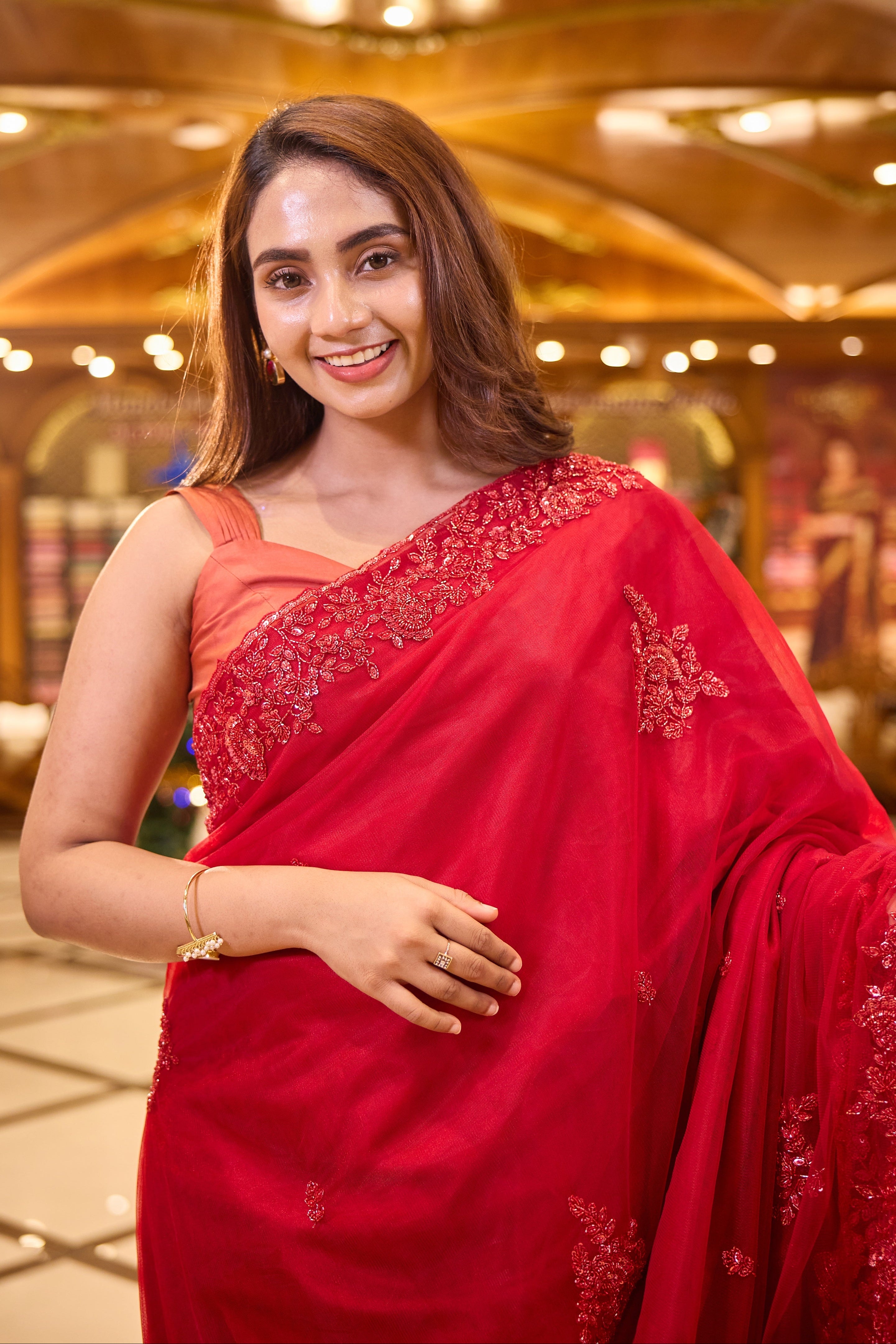 Cherry Red colour Hand dyed Premium Designer Saree, crafted in full net fabric with intricate self colour thread and bead embroidery, finished with an elegant scallop border and paired with a matching worked blouse.
