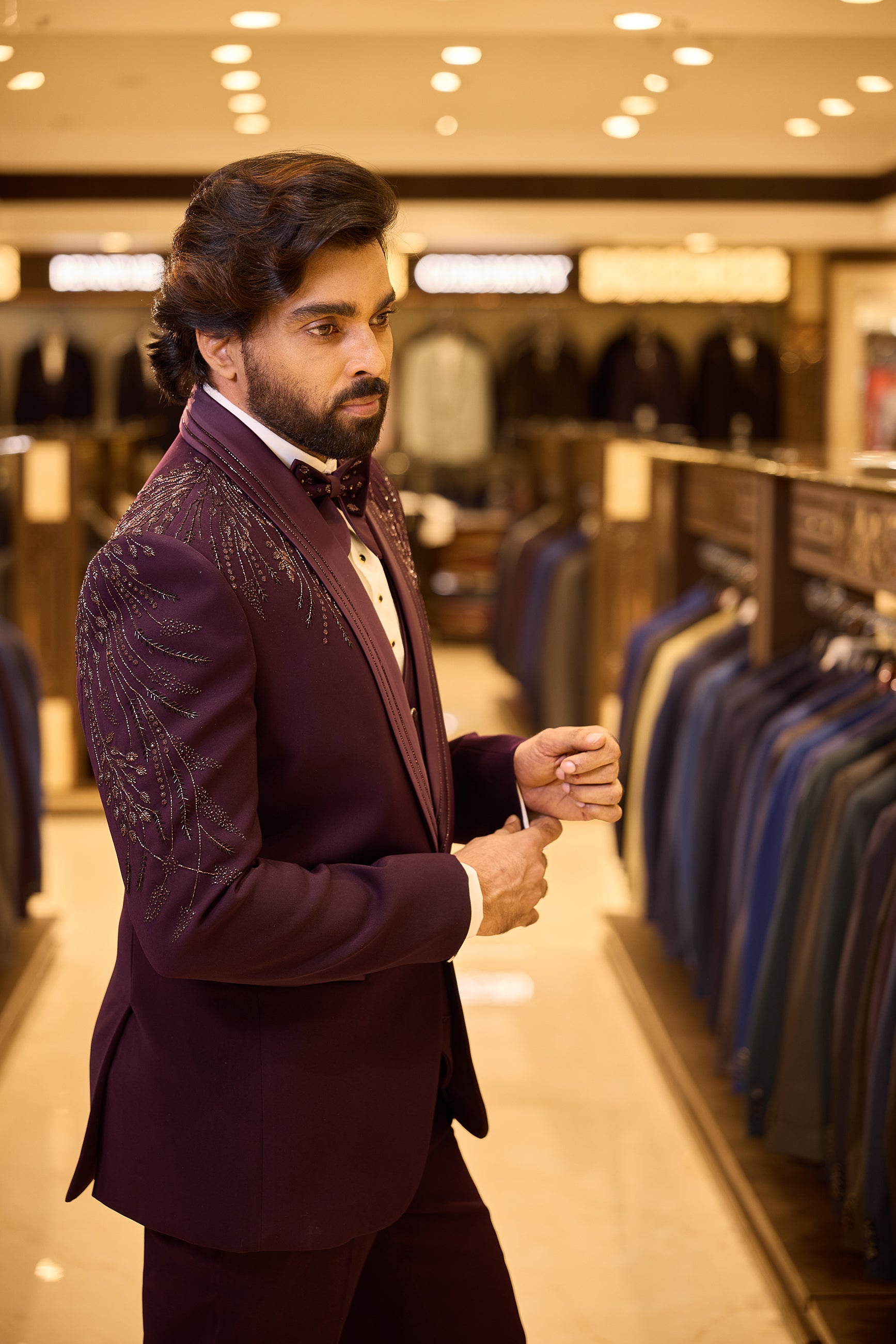 Rich purple colour 5 piece tuxedo suit crafted in premium polynosic fabric, featuring gold tone leaf beadwork all over and finished with a sleek satin lapel and single button closure for a regal groom look