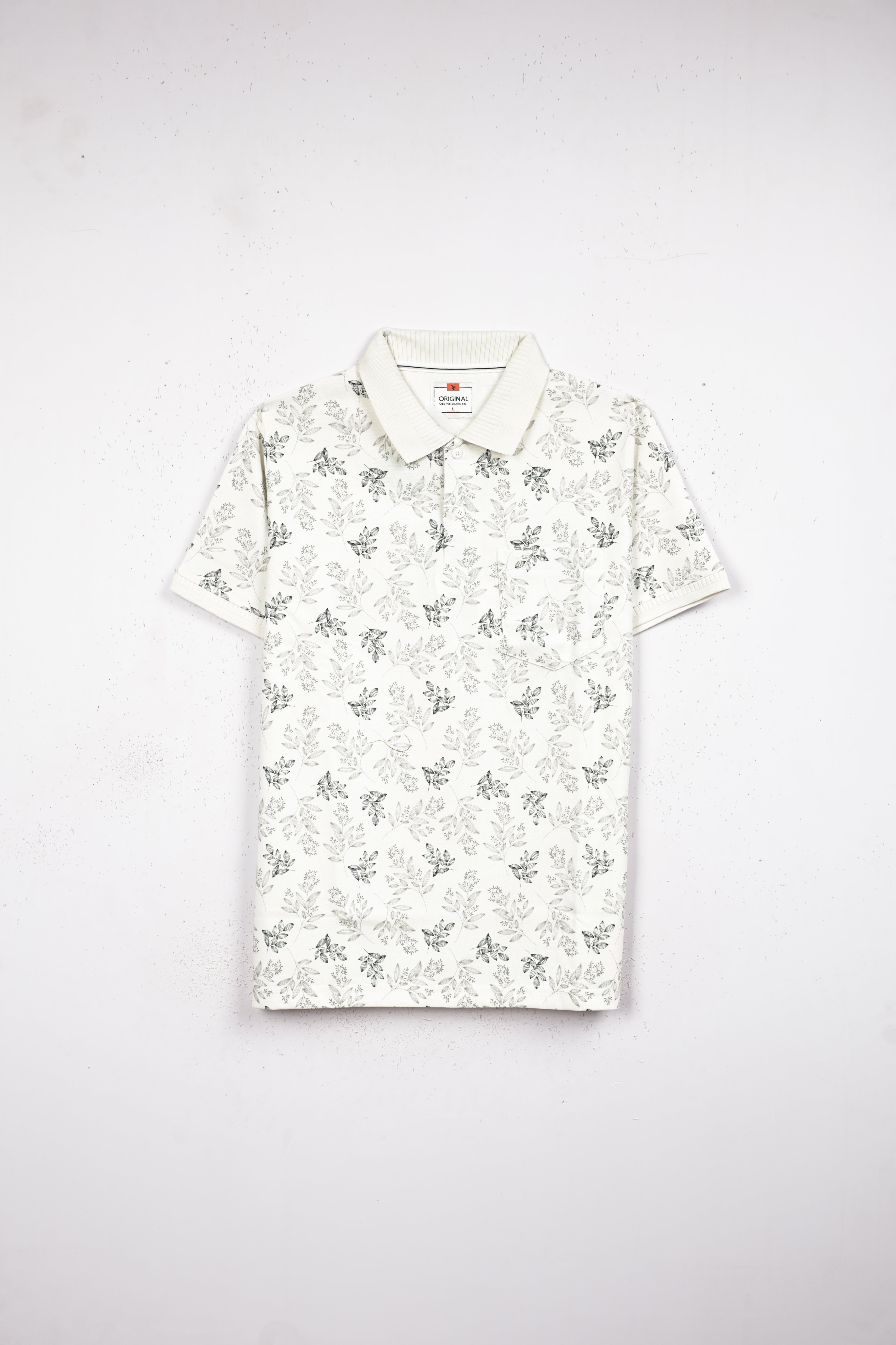 Cream colour T shirt featuring leaf pattern print on body, collar design, Half sleeve.