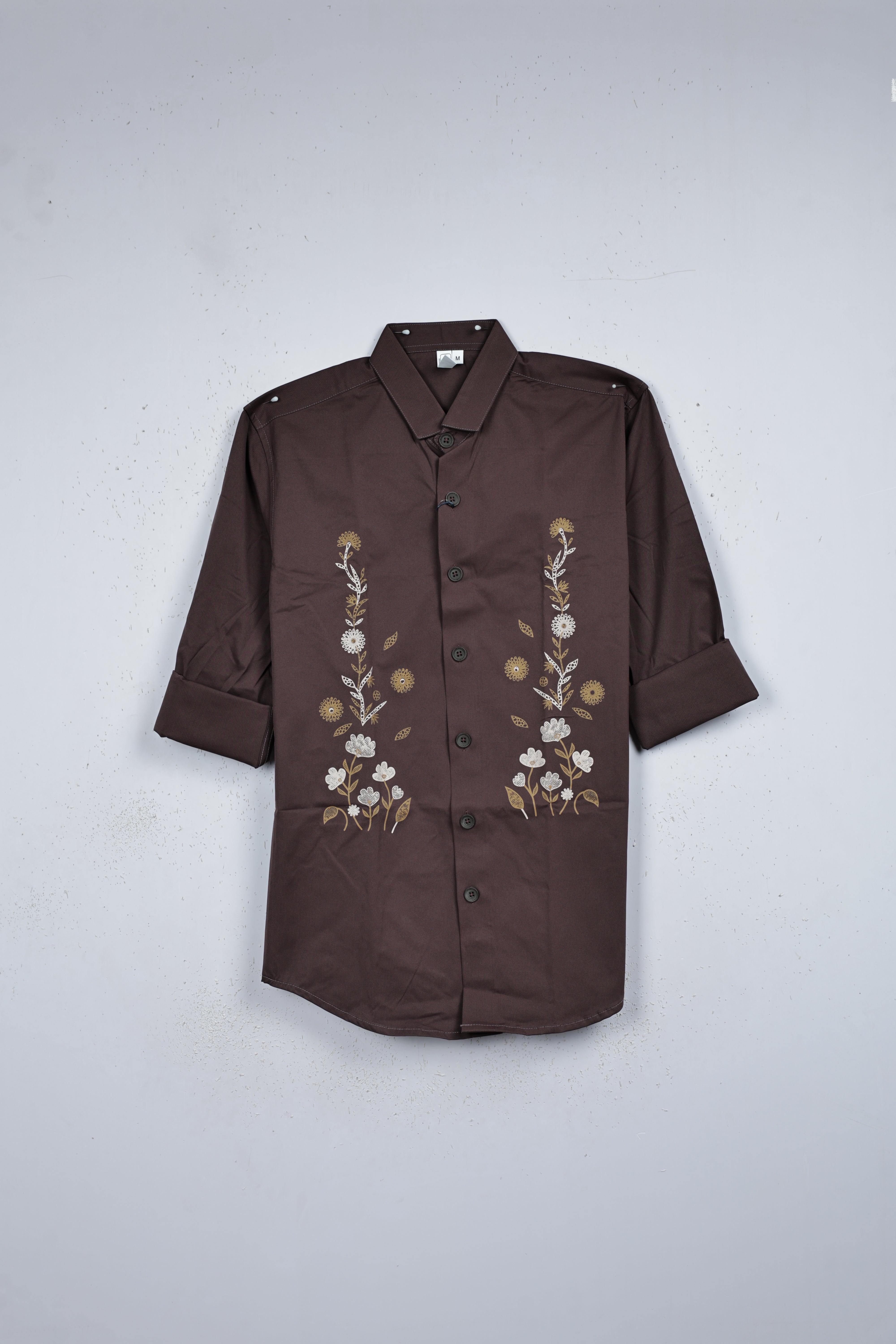 Brown colour shirt designed with floral kodi pattern print on body, full sleeve.