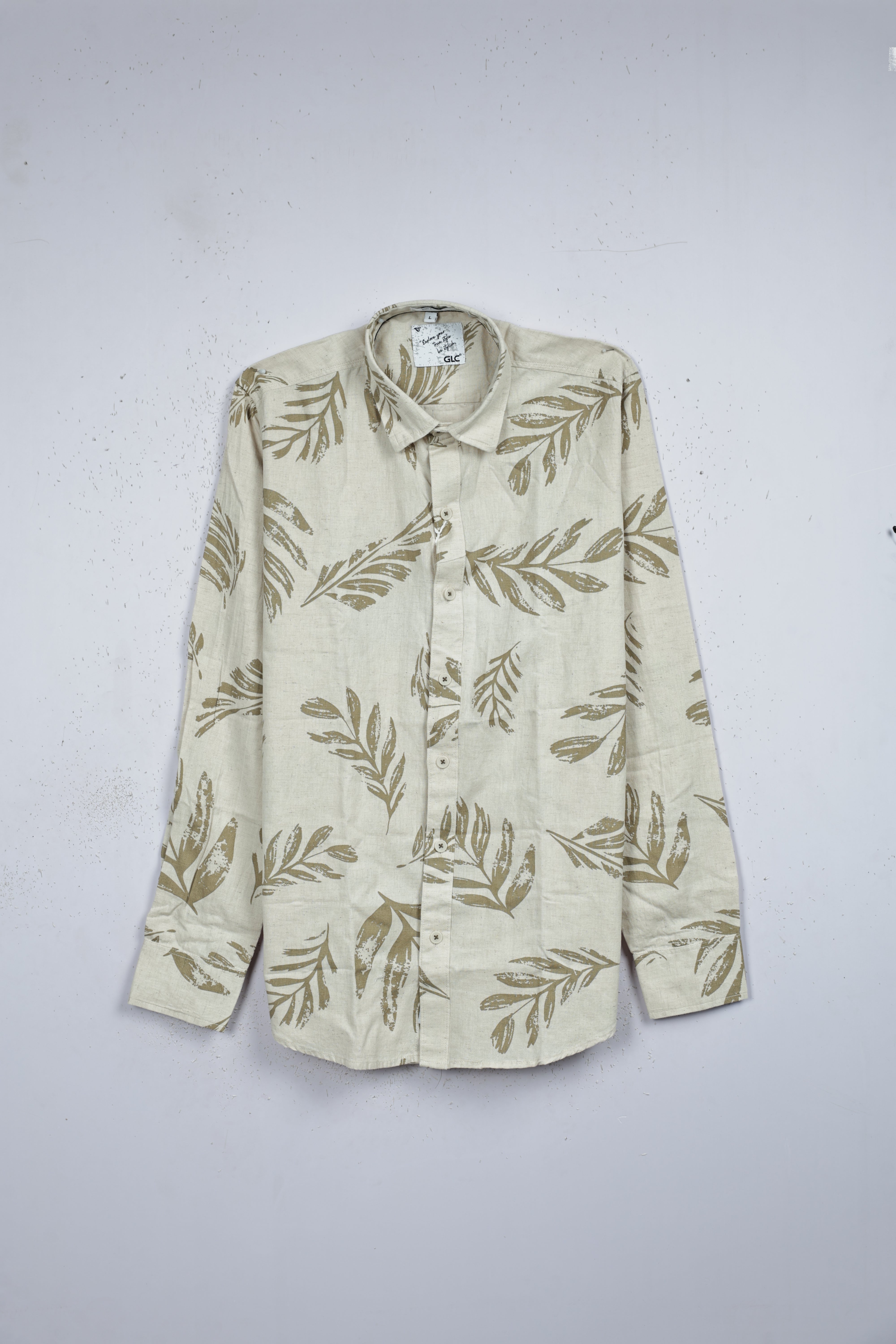 Cream colour shirt designed with olive color leaf print on body, adored with full sleeve