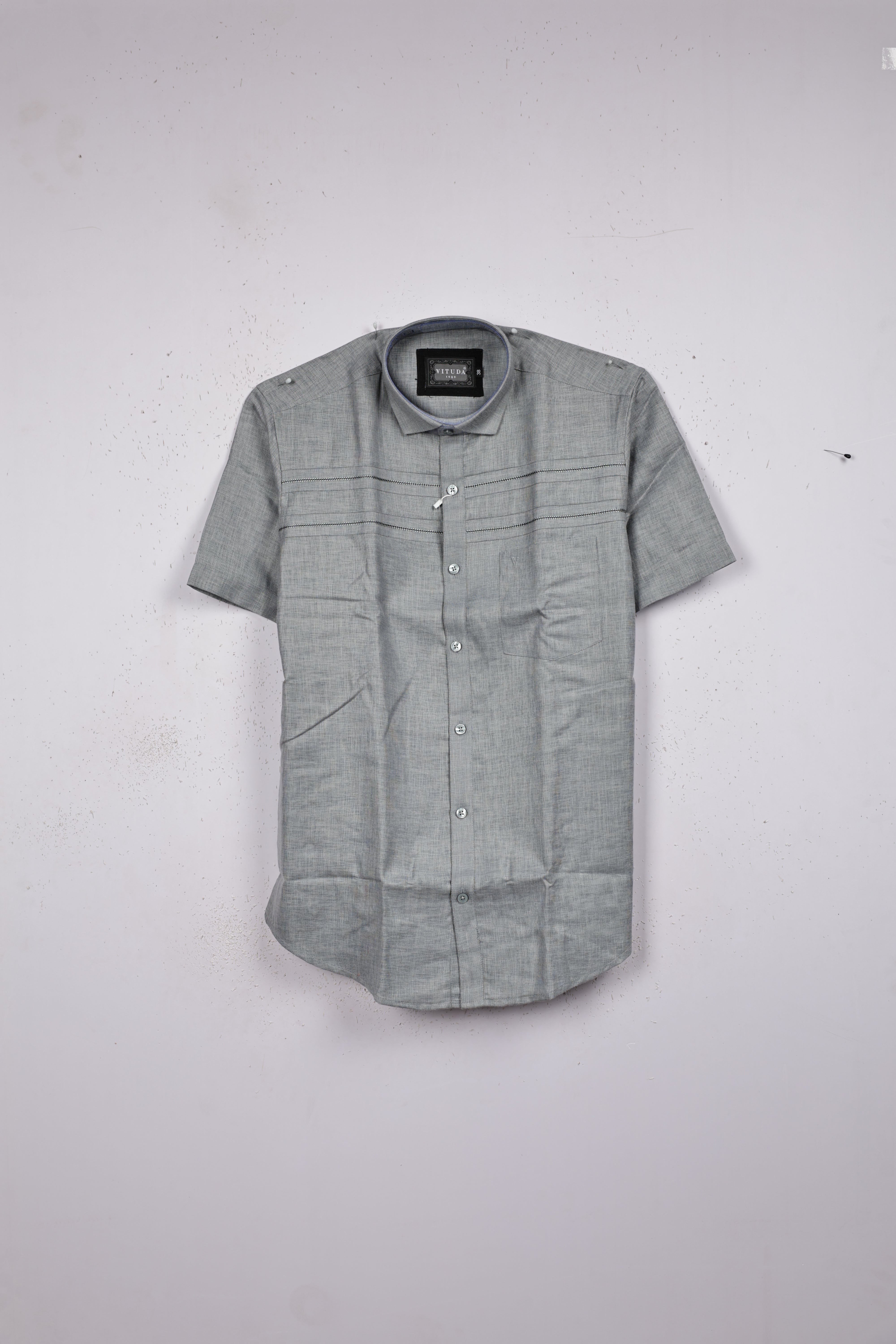 Grey colour shirt designed with stone pattern on body, half sleeve.