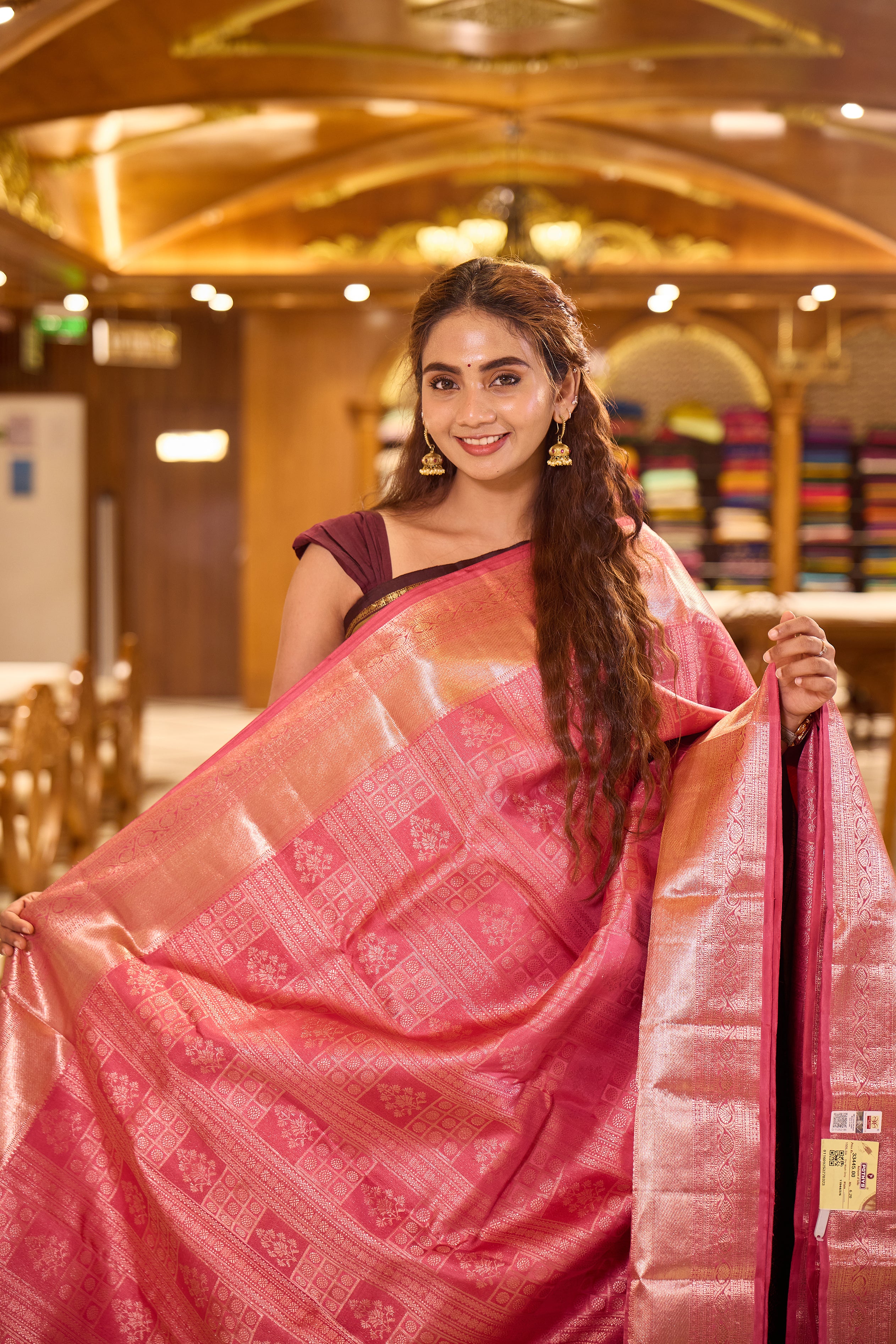 Plush Pink colour Kancheepuram Samudrika Silk Saree featuring multi pattern geometric jacquard weaving with rich antique gold Zari detailing, complemented by a matching designer jacquard blouse piece.