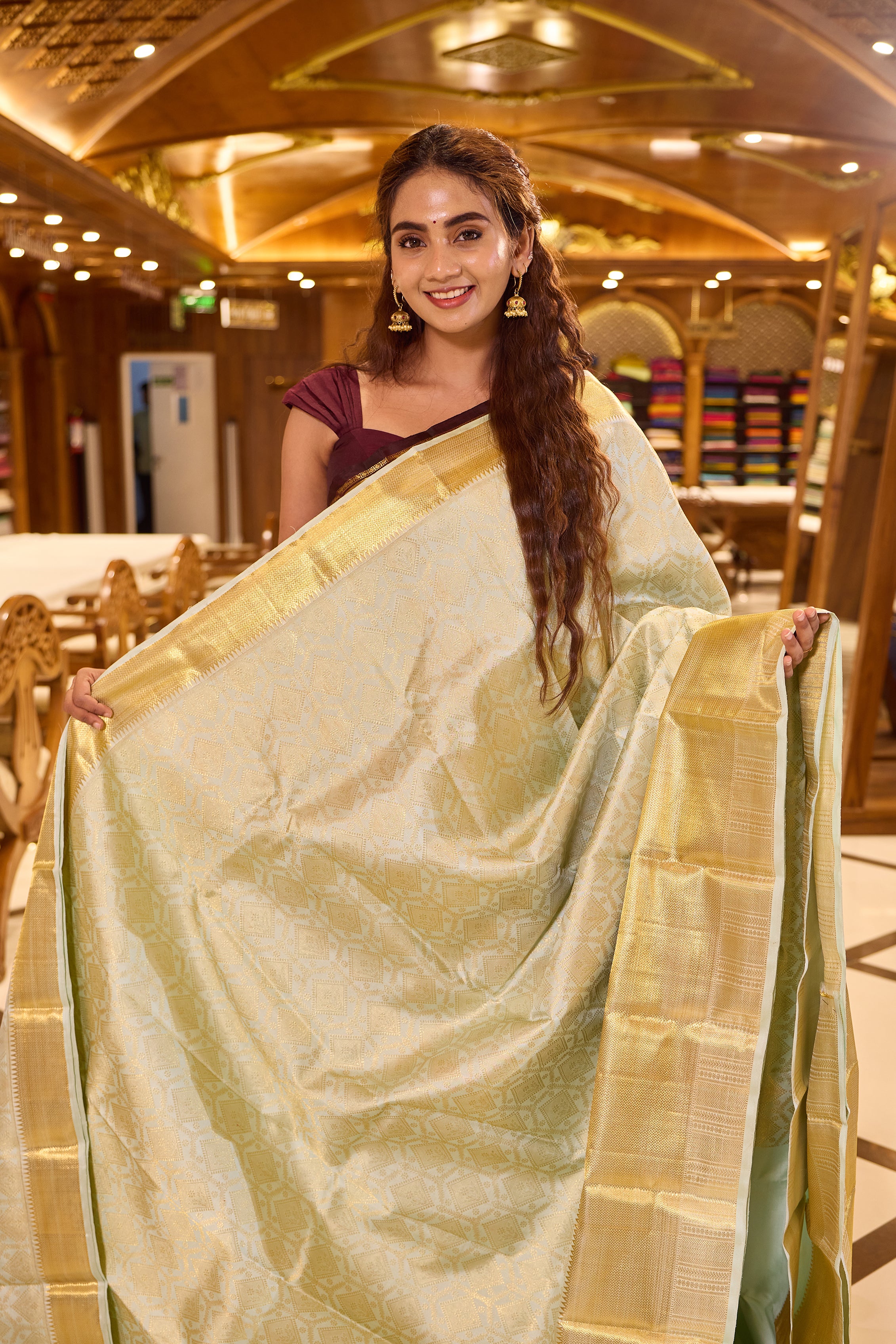 Powder Blue Kanchipuram Samudrika Silk Saree with traditional gold jari diamond and floral wedding brocade weaving, finished with a rich gold border and paired with a plain blouse featuring a traditional jari border