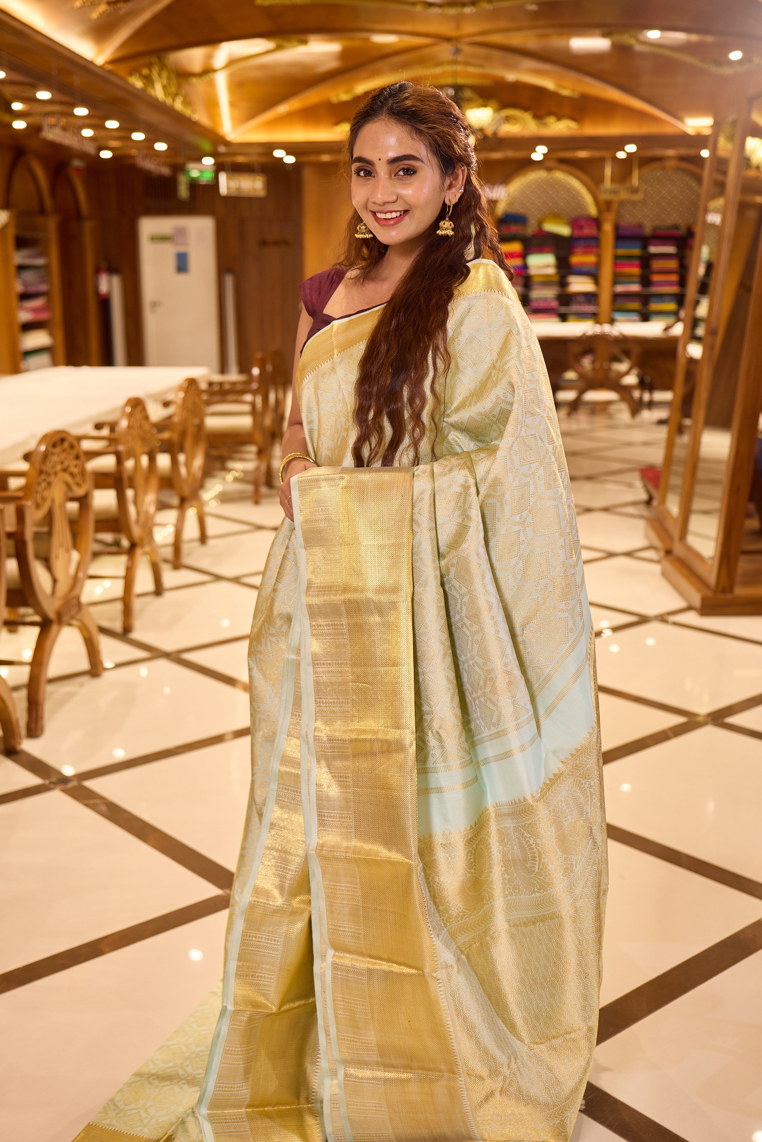 Powder Blue Kanchipuram Samudrika Silk Saree with traditional gold jari diamond and floral wedding brocade weaving, finished with a rich gold border and paired with a plain blouse featuring a traditional jari border