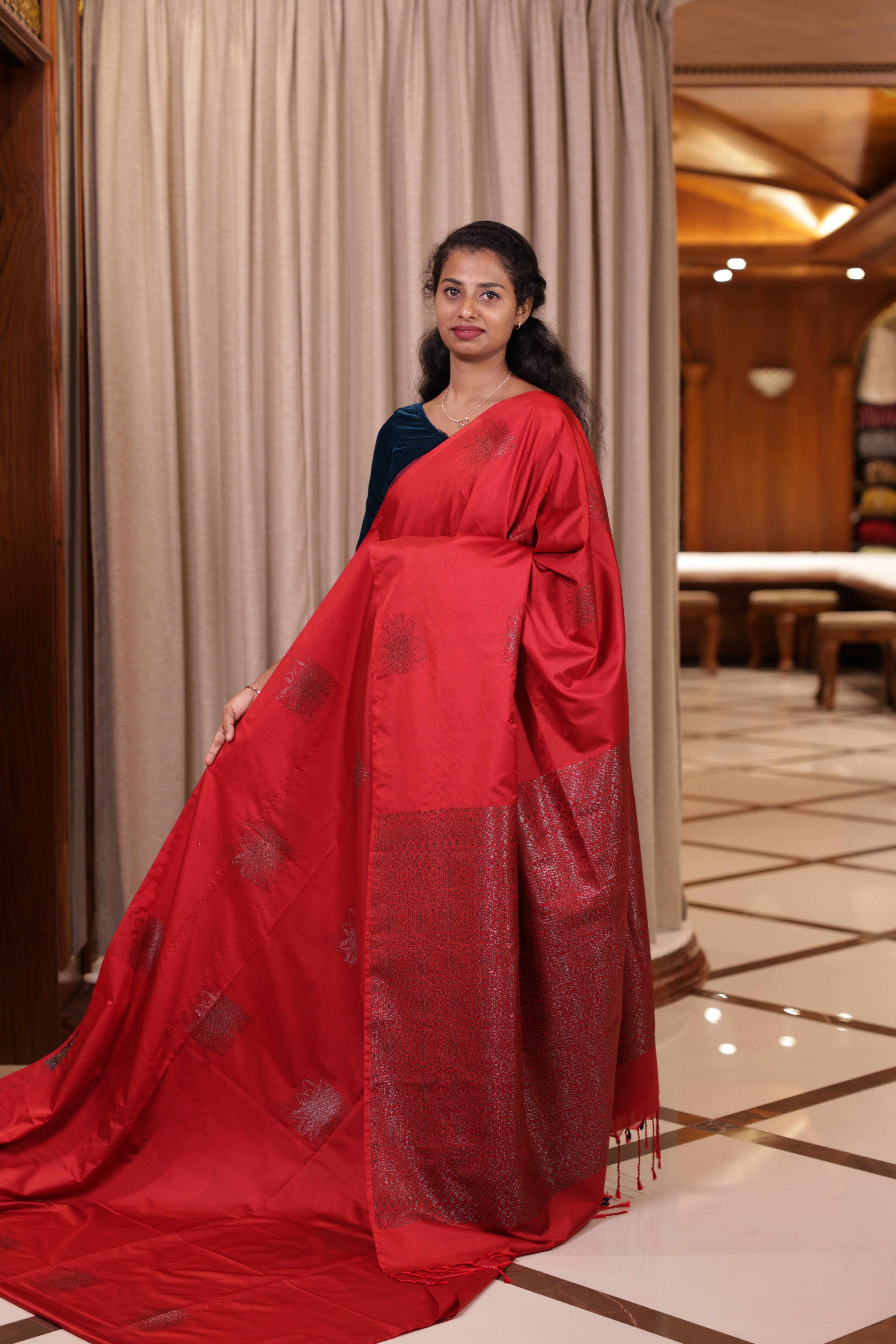 Garnet colour Soft semi silk Palavarna Pattu saree adorned with metallic zari design in self & contrast patterns, The rich pallu enhances its charm, paired with a matching blouse piece for a graceful traditional look.