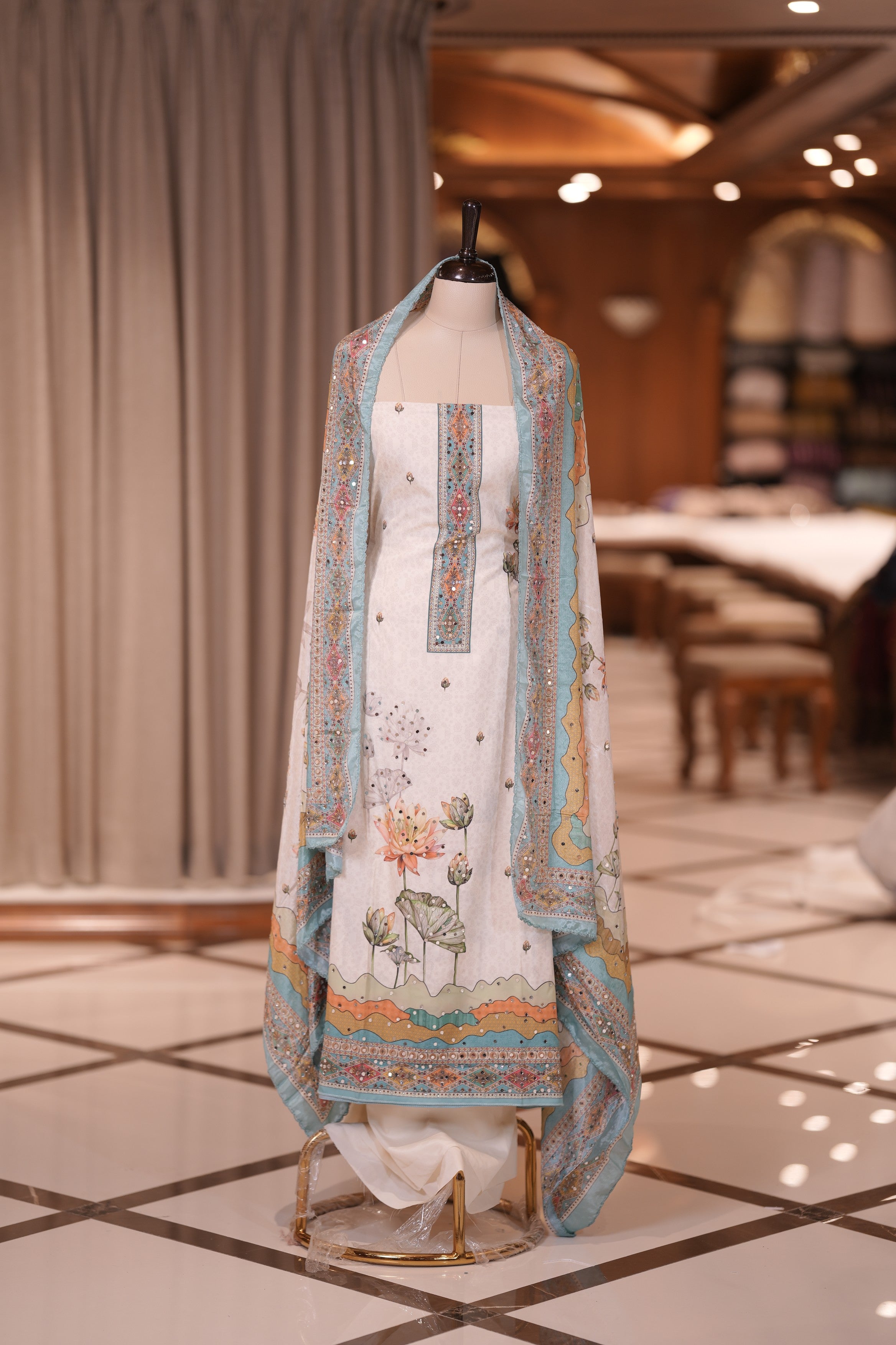 Blue Colour Crepe Material Top Embellished with Elegant Lotus Print and Mirror Work, Paired with a Matching Designed Dupatta and Plain Bottom