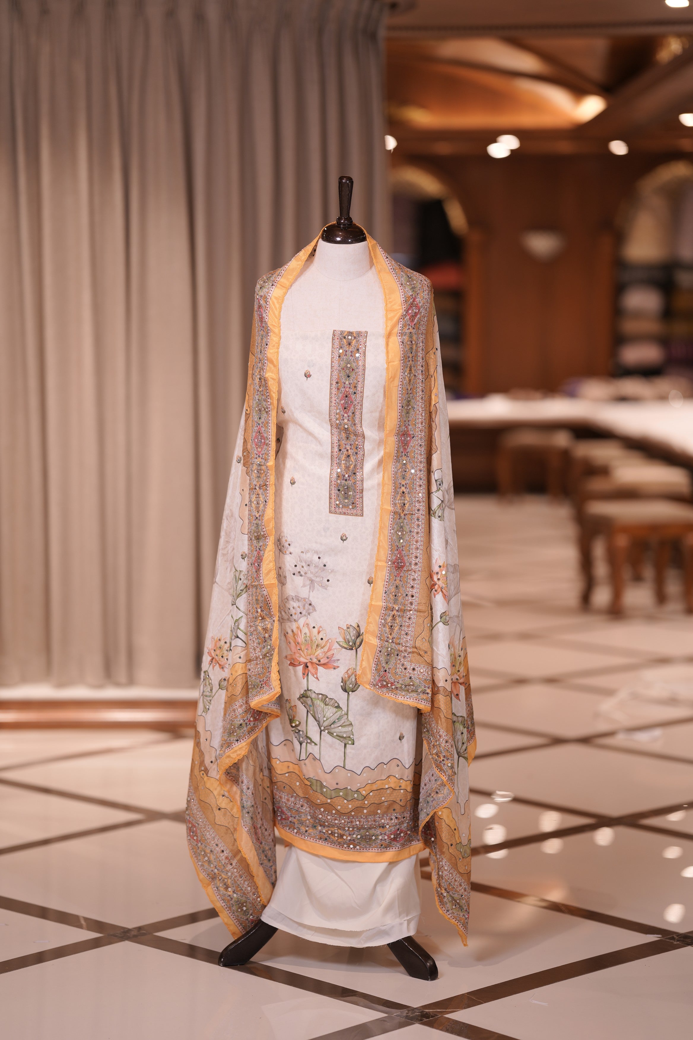 Yellow Colour Crepe Material Top Embellished with Elegant Lotus Print and Mirror Work, Paired with a Matching Designed Dupatta and Plain Bottom