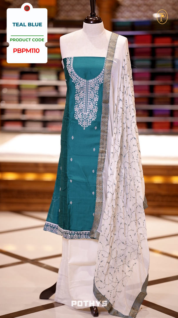 Blue colour semi silk salwar set highlighted with intricate white chikankari embroidery on the neckline and body, paired with matching bottom and contrasting ivory dupatta.