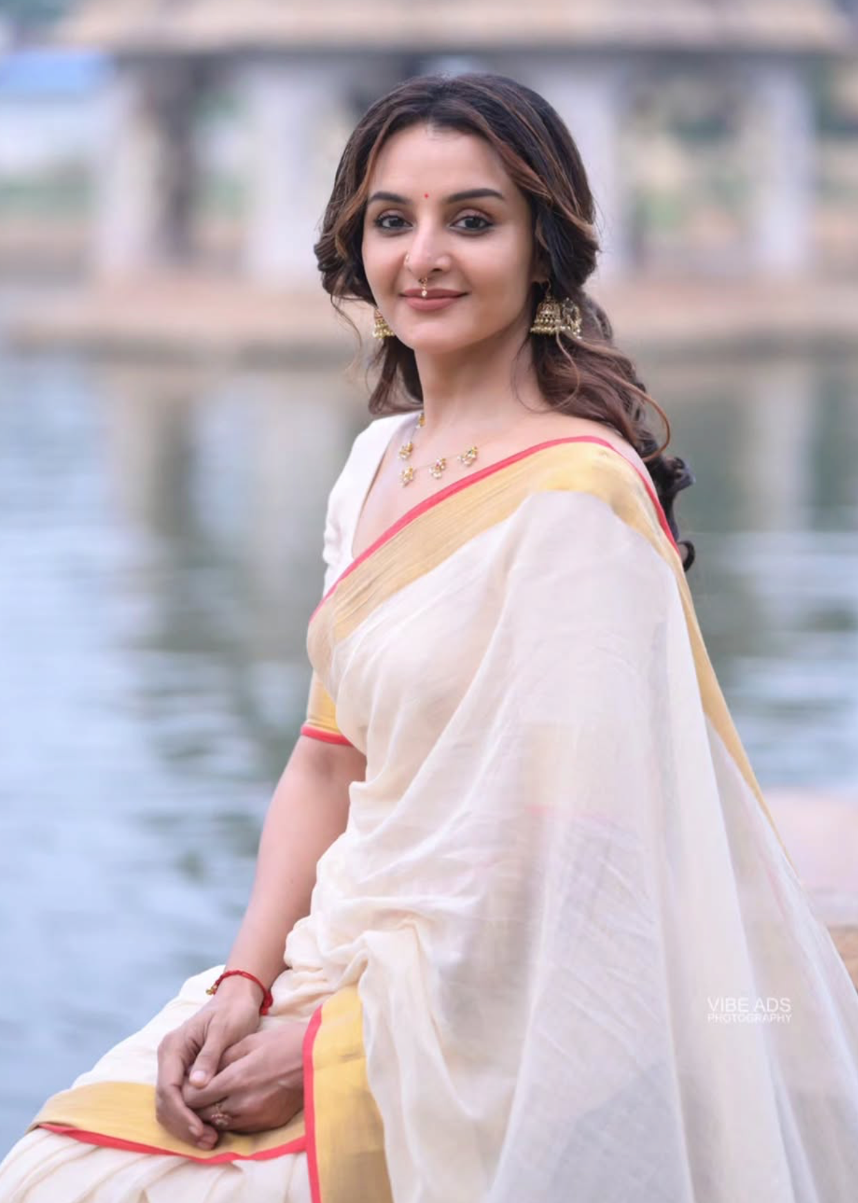 White colour Chanderi cotton saree with a plain body, featuring a Contrast border, paired with a matching blouse piece.