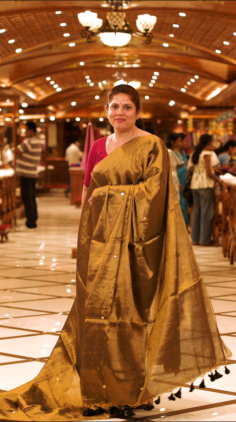 Olive green colour Semi Tissue saree featuring a plain body adorned with delicate sequin detailing throughout, crafted in a borderless design. Comes without a blouse piece.