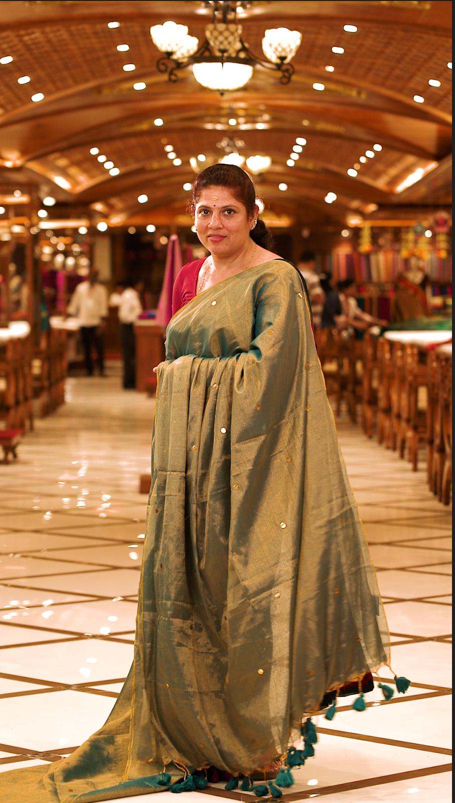Green colour Semi Tissue saree featuring a plain body adorned with delicate sequin detailing throughout, crafted in a borderless design. Comes without a blouse piece.