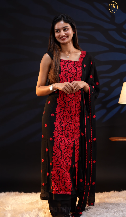 Black colour georgette salwar material featuring floral threadwork, heavy threadwork with sequin detailing on the center, a scalloped dupatta with threadwork, and Shantoon bottom.