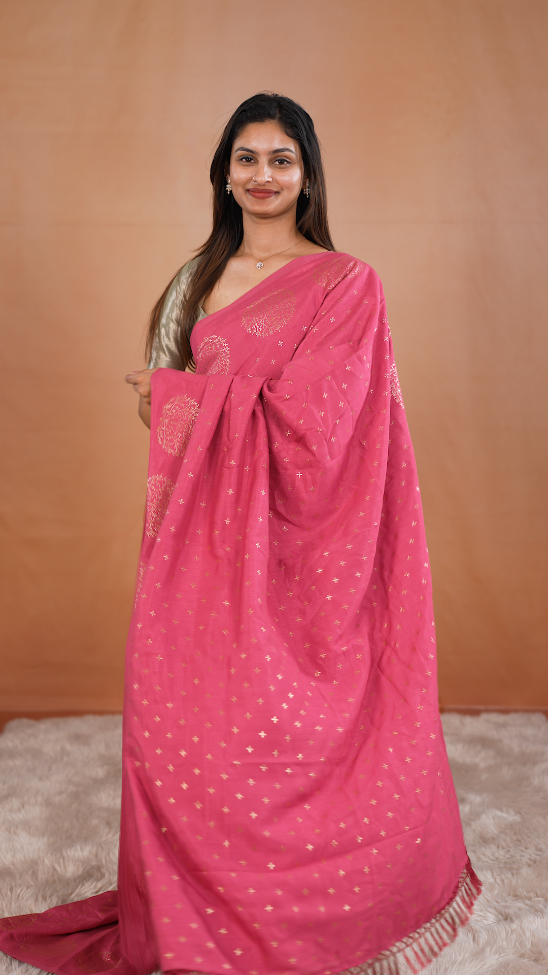 Peach colour vijithra silk saree featuring small zari details on body, Tree design border.