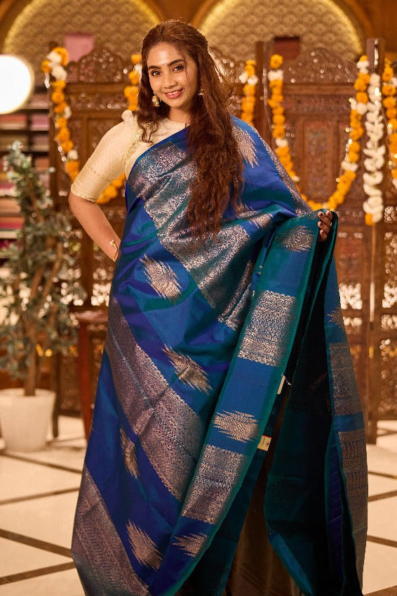 Borderless peacock blue thazampoo rekku, and geometric patterns zari woven Kanchipuram silk saree, zari pallu of manga and paiyaadi kattam designs