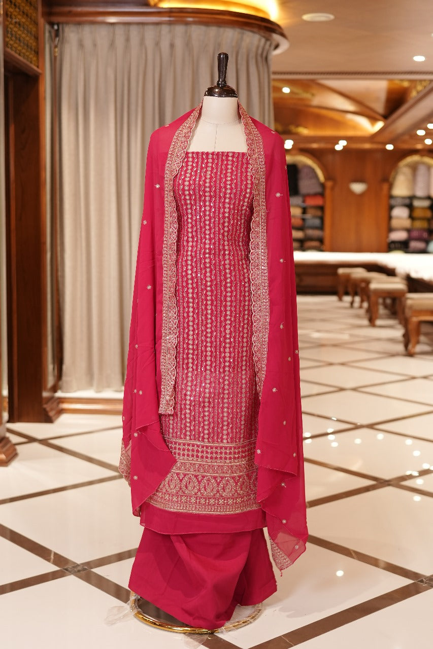 Rani Pink Colour Georgette top adorned with gold zari and sequin work, paired with a scallop bordered dupatta featuring golden zari embroidery and a plain bottom.