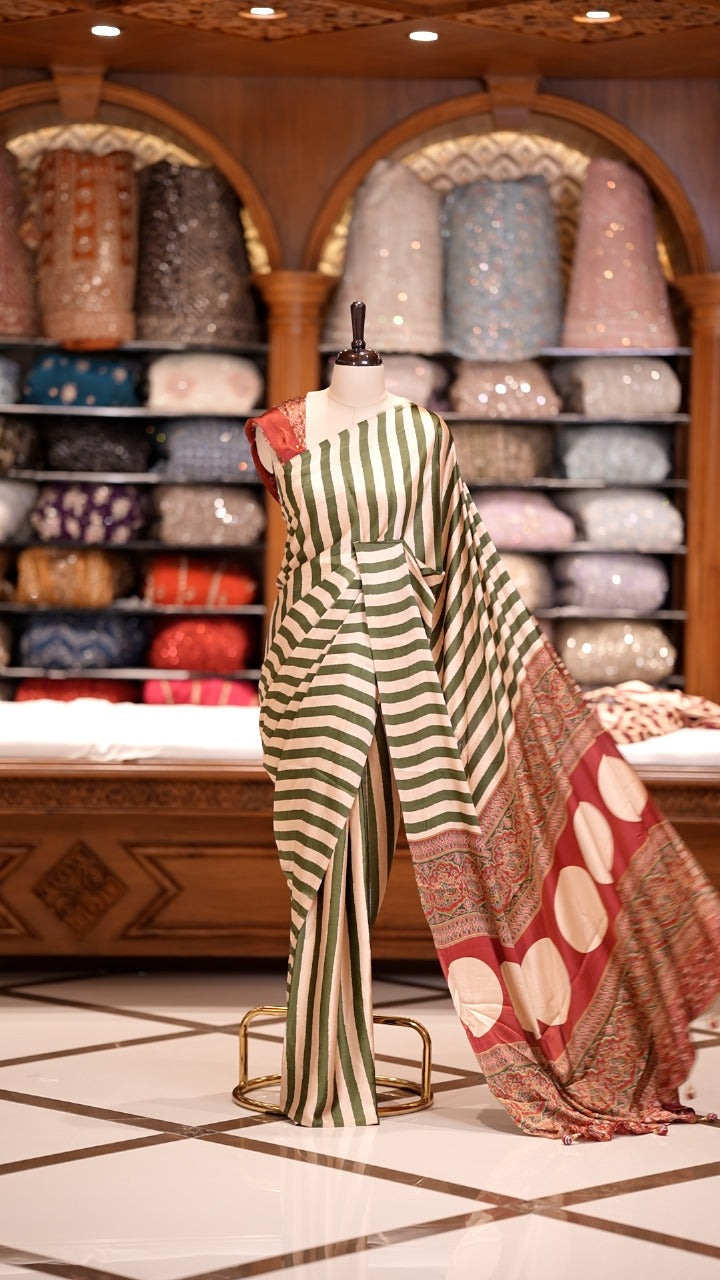 Cream and Green striped Semi modal silk saree highlighted with a rich pallu featuring artistic motifs, paired with a matching blouse