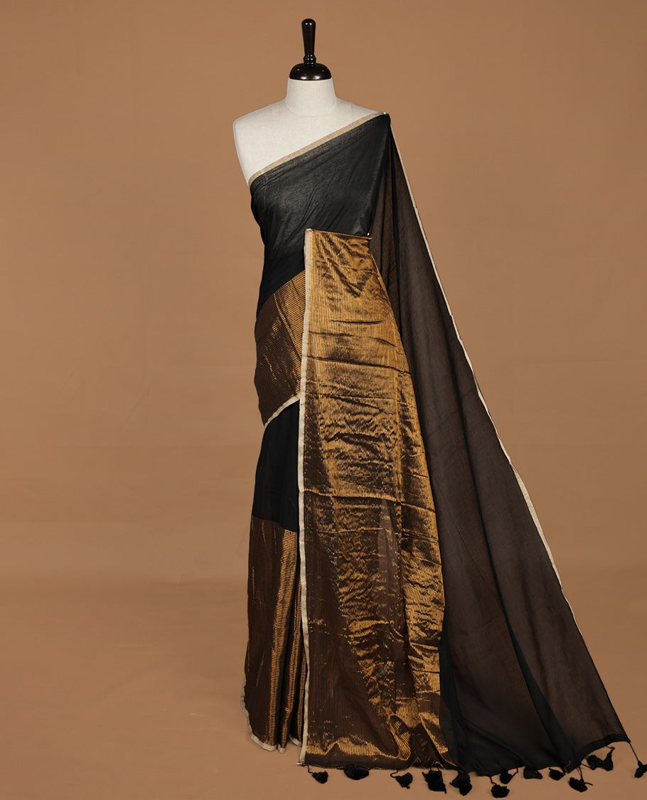 Black mul cotton saree with an elegant half and half design, blending plain fabric with a contrasting tissue finish, without blouse piece.