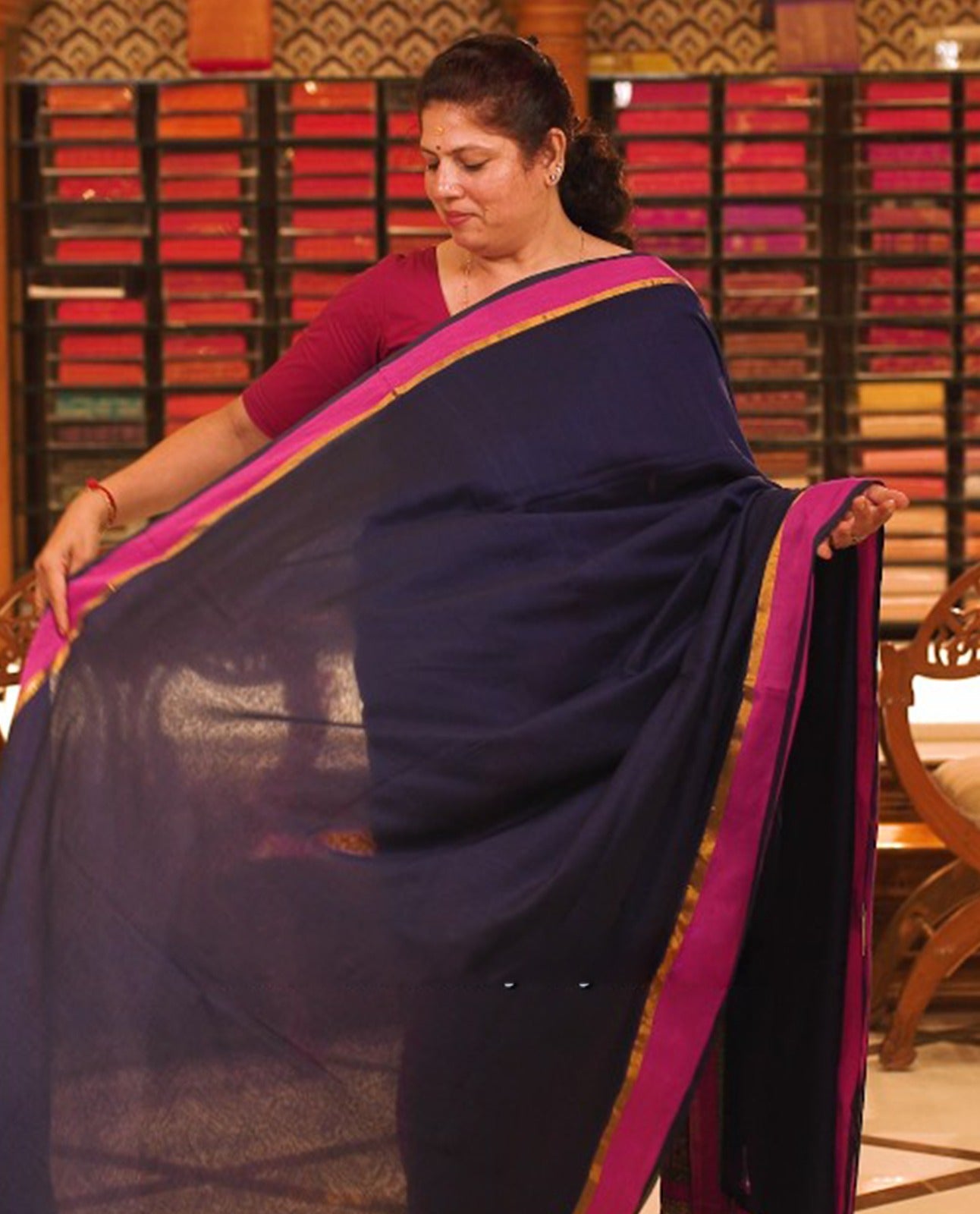 Blue colour Mul Cotton saree featuring a simple plain body with a contrast border, offering a classic and elegant look. Comes without a blouse piece.