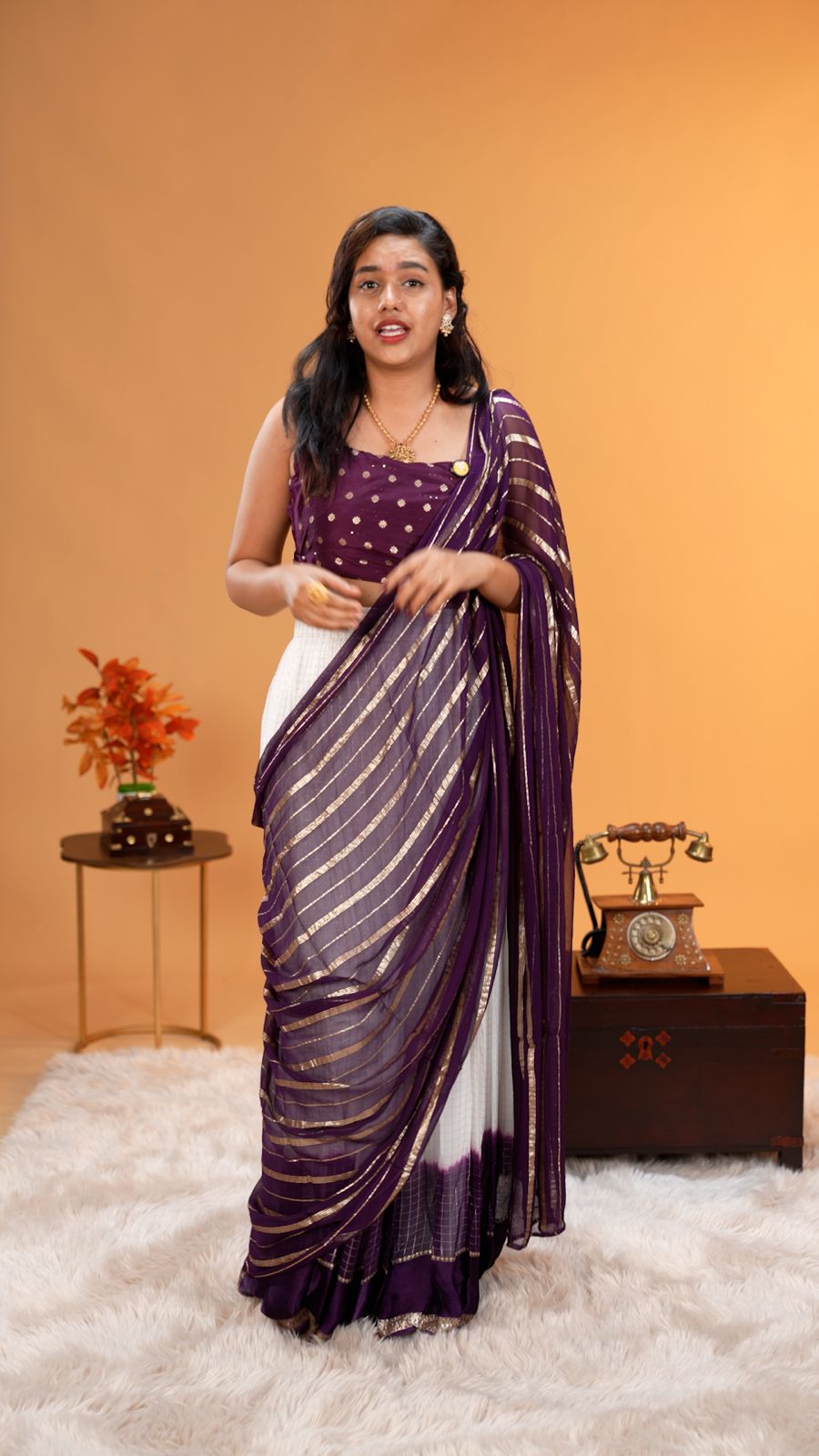 Violet colour Georgette Dhavani material featuring white skirt with Check pattern & border, Small floral work on blouse piece, same colour dupatta with strips.