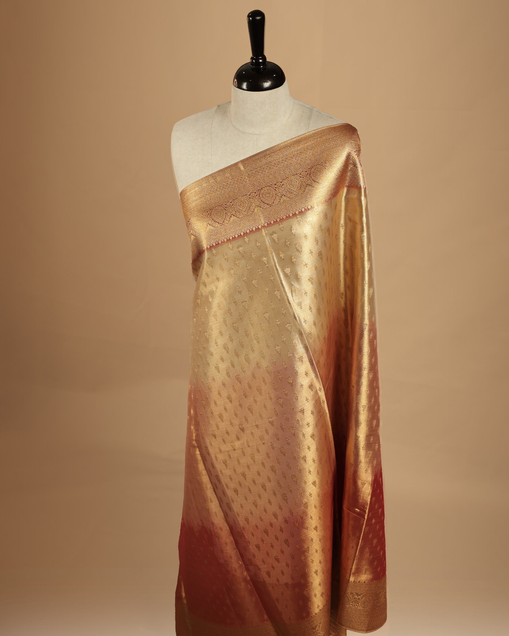 Brown, light brown , gold triple shade colour semi Tissue silk saree featuring gold zari motifs on body, complemented by gold zari traditional border, paired with matching blouse piece.