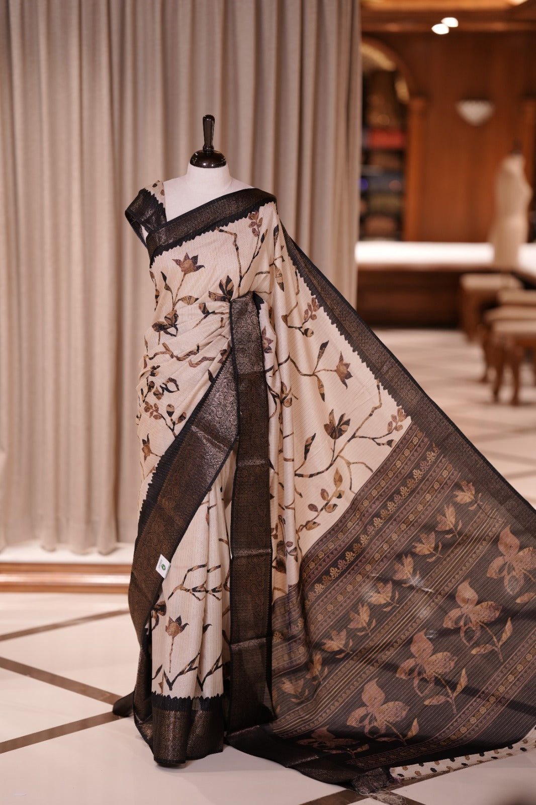 Beige colour dolla silk saree adorned with beautiful kalamkari prints, complemented by a rich golden zari border & The pallu features intricate kalamkari detailing, paired with a matching blouse.