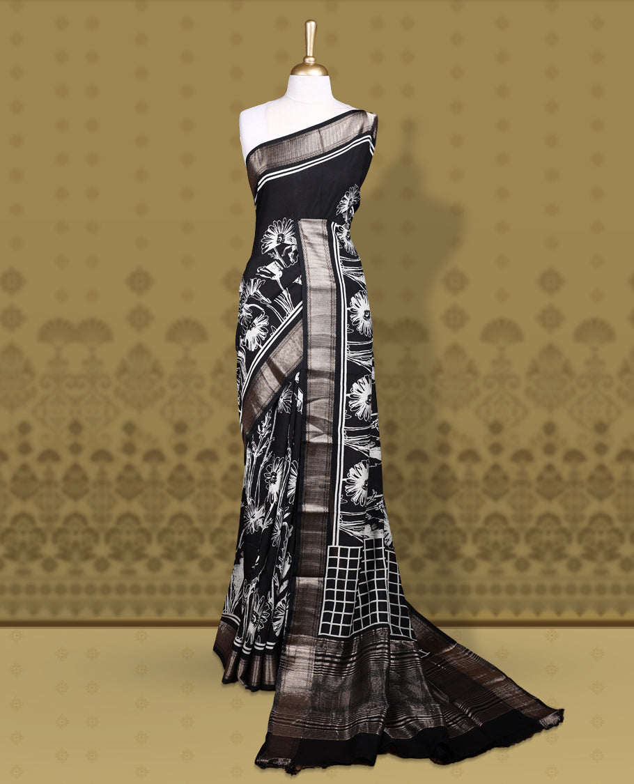 Black colour saree with off white floral and geometric prints, featuring a contrast zari border and beautifully detailed printed pallu & Comes with a matching black blouse piece.