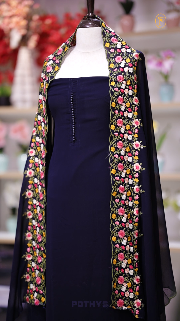 Turquoise blue colour Chiffon churidhar material featuring a plain top adorned with delicate beads work on the neckline, paired with a plain bottom, Highlighted by a dupatta with floral embroidery, sequins, and scalloped edges.