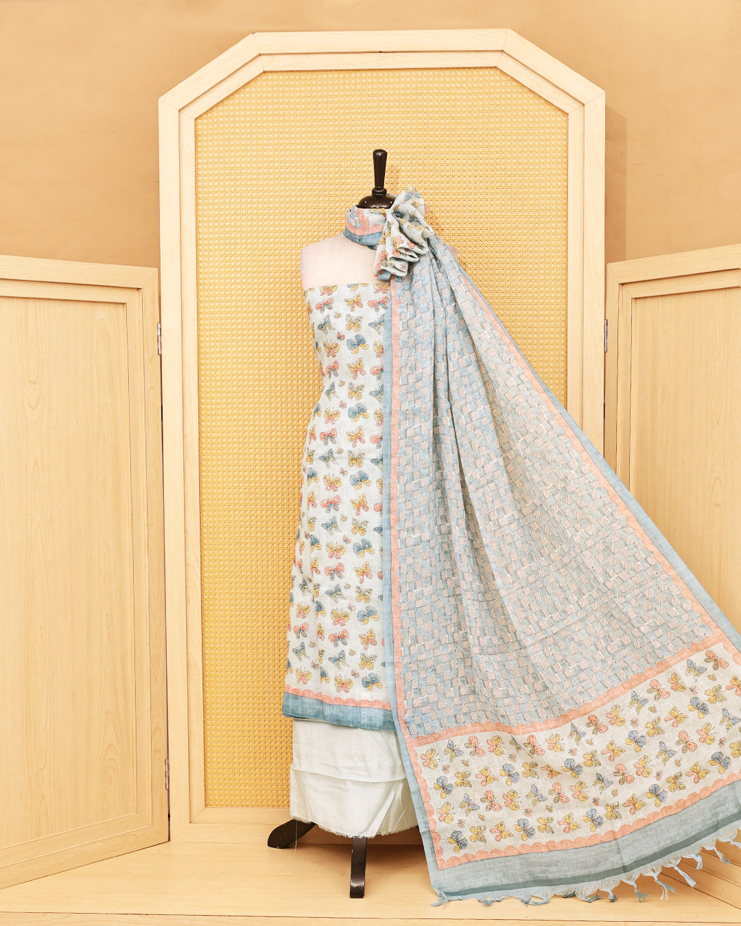 Pastel blue colour linen Salwar Material featuring delightful multicolor butterfly motifs, paired with a classic white bottom and a beautifull dupatta