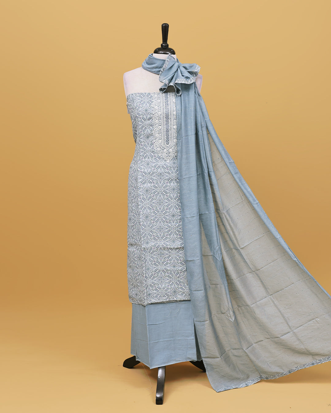 Cream colour Net cotton Salwar material with Grey colour floral kodi pattern work on body, matching bottom & Dupatta.