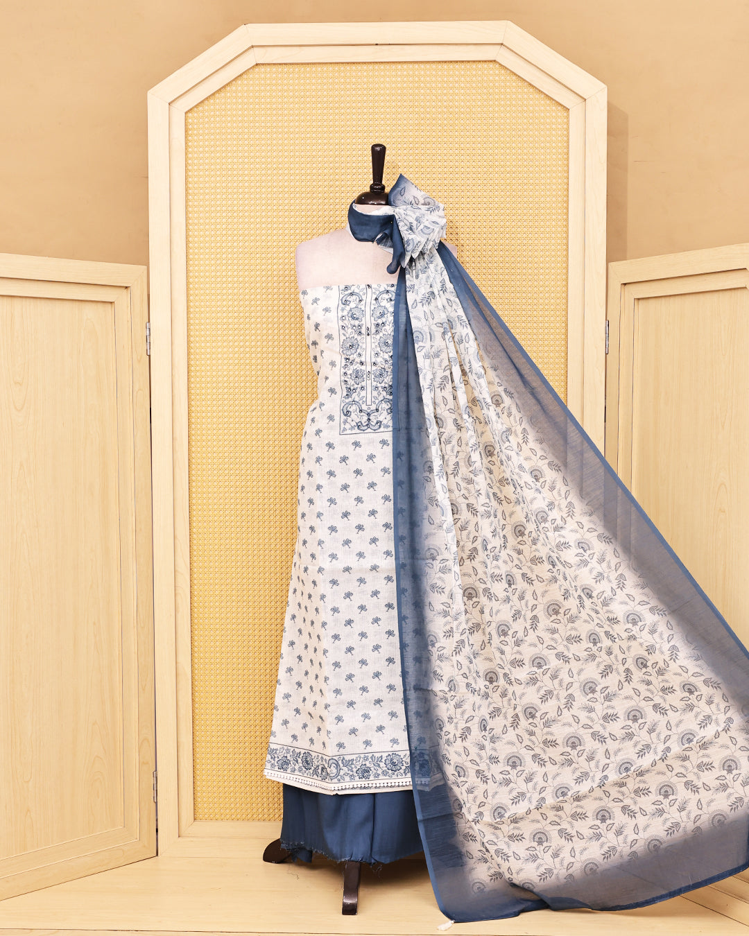 Off White colour Linen salwar material featuring Print & mirror work on body, paired with Contrast Greyish Blue colour bottom & dupatta.