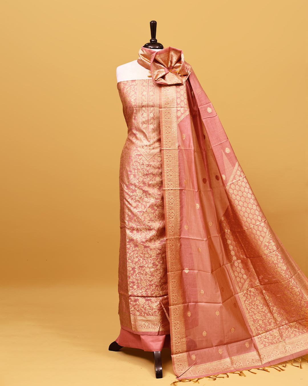 Pink colour Banaras Salwar material with gold zari floral kodi pattern work on body, matching bottom & Dupatta.
