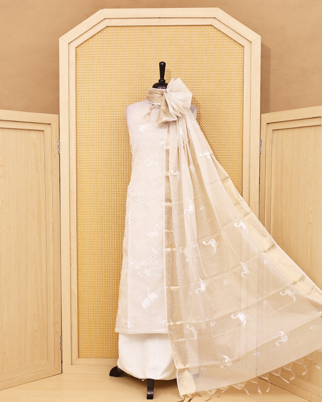 White colour Net Kota Salwar material on thread work on body, paired with matching bottom & Dupatta.
