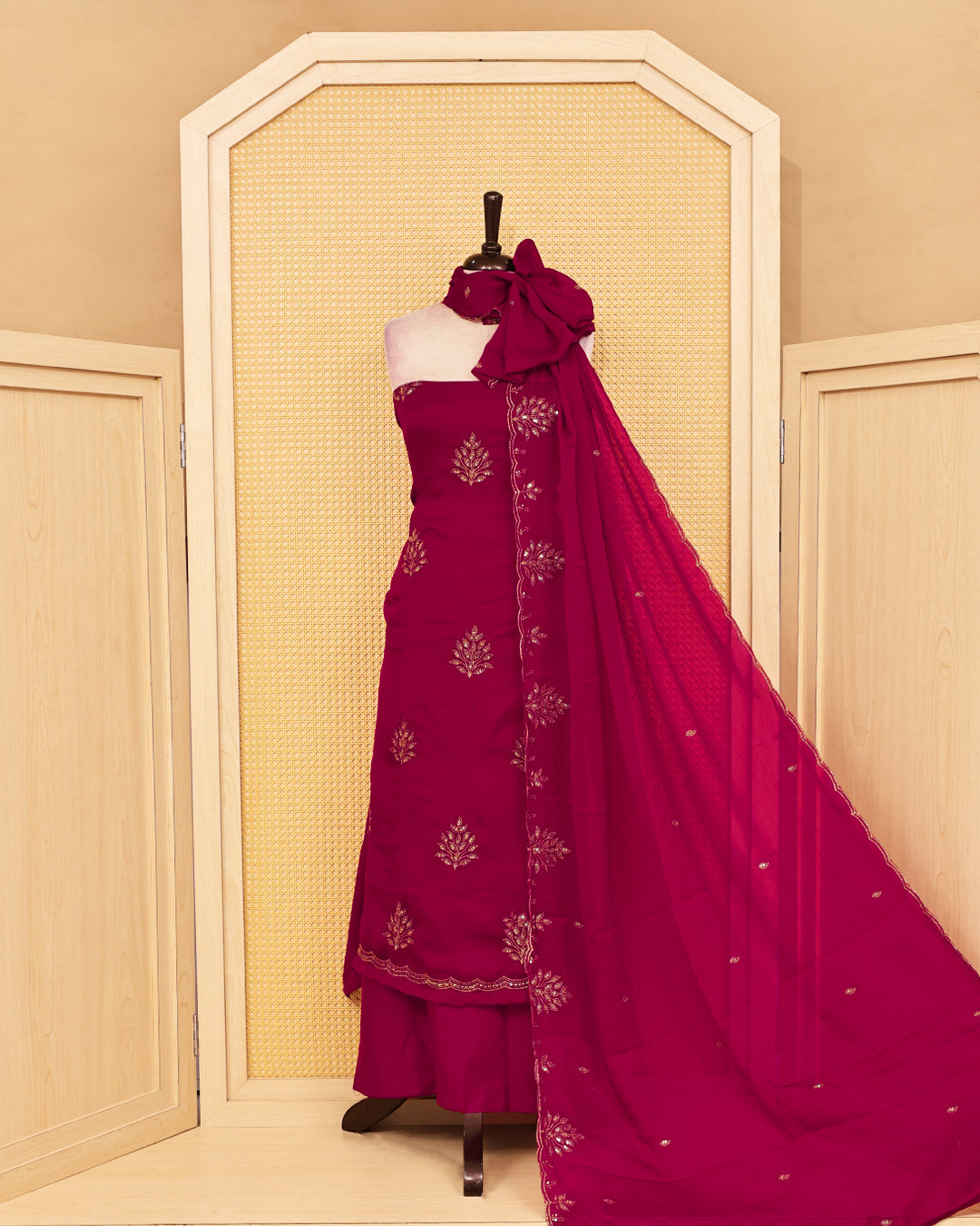 Deep Red colour salwar material featuring Thread with Sequin work on body, paired with matching bottom & dupatta.