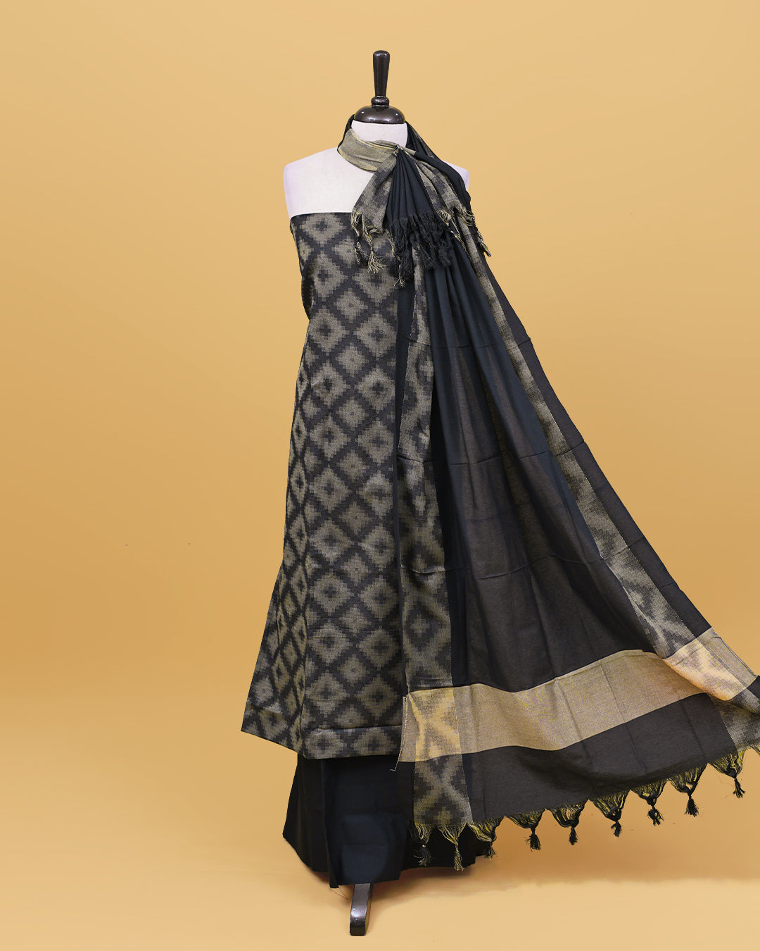 Black colour Net cotton Salwar material with Geometric pattern work on body, matching bottom & Dupatta.
