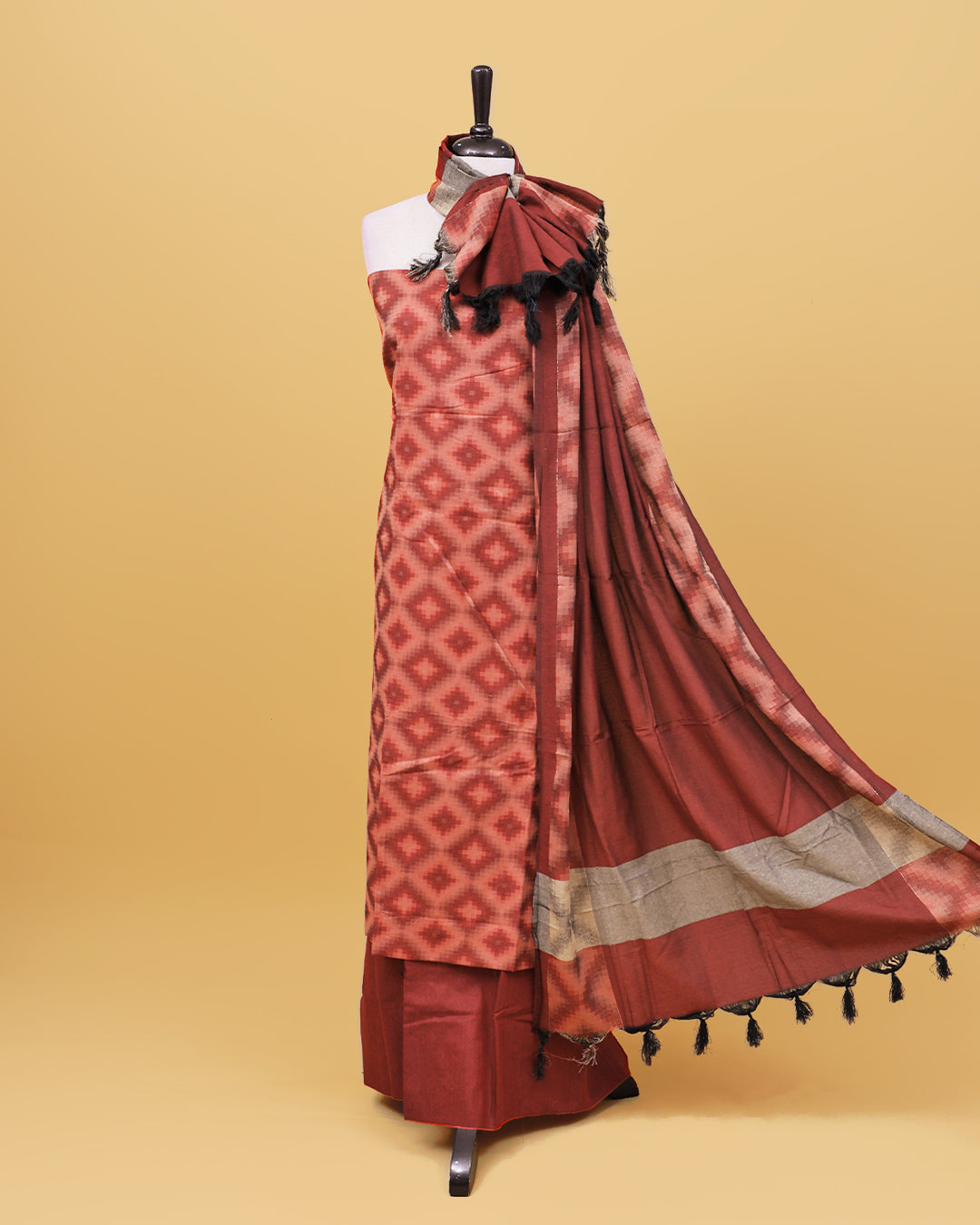Brick red colour Net cotton Salwar material with Geometric pattern work on body, matching bottom & Dupatta.