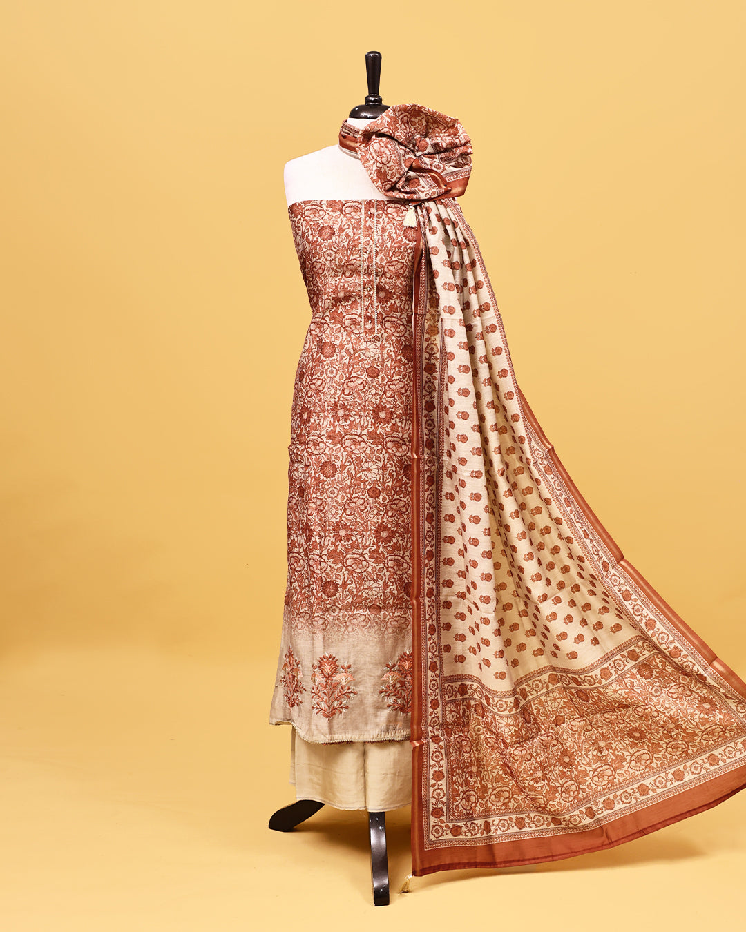 Brown colour Salwar material with Floral kodi pattern on body, matching bottom & Dupatta.