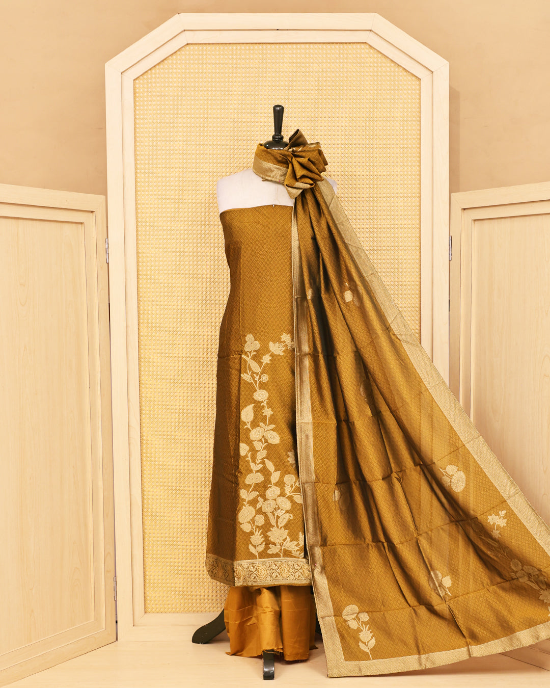 Golden Olive colour Banaras salwar material featuring Zari floral work on body, paired with Matching bottom & dupatta.