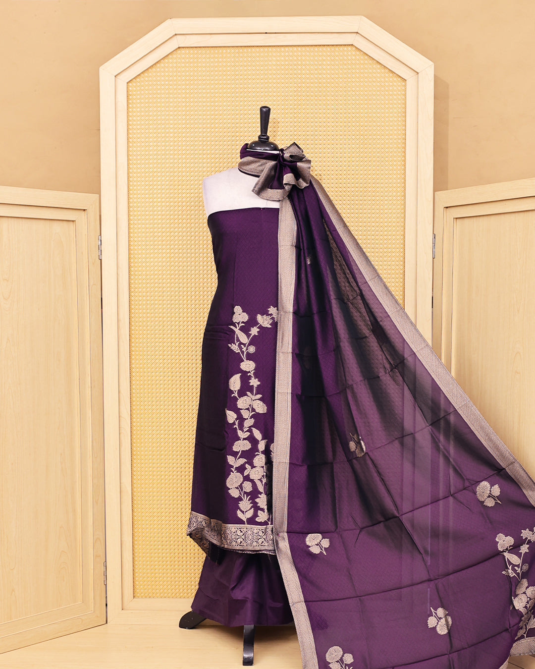 Purple colour Banaras salwar material featuring Zari floral work on body, paired with Matching bottom & dupatta.