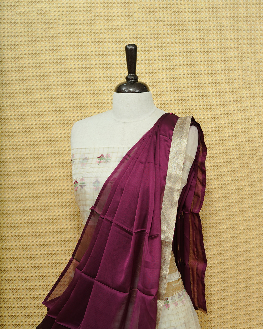 Cream colour Semi stitched Dhavani set featuring Gold zari checked pattern with floral motifs on skirt with traditional border, comes with contrast Colour Dupatta & matching blouse piece.