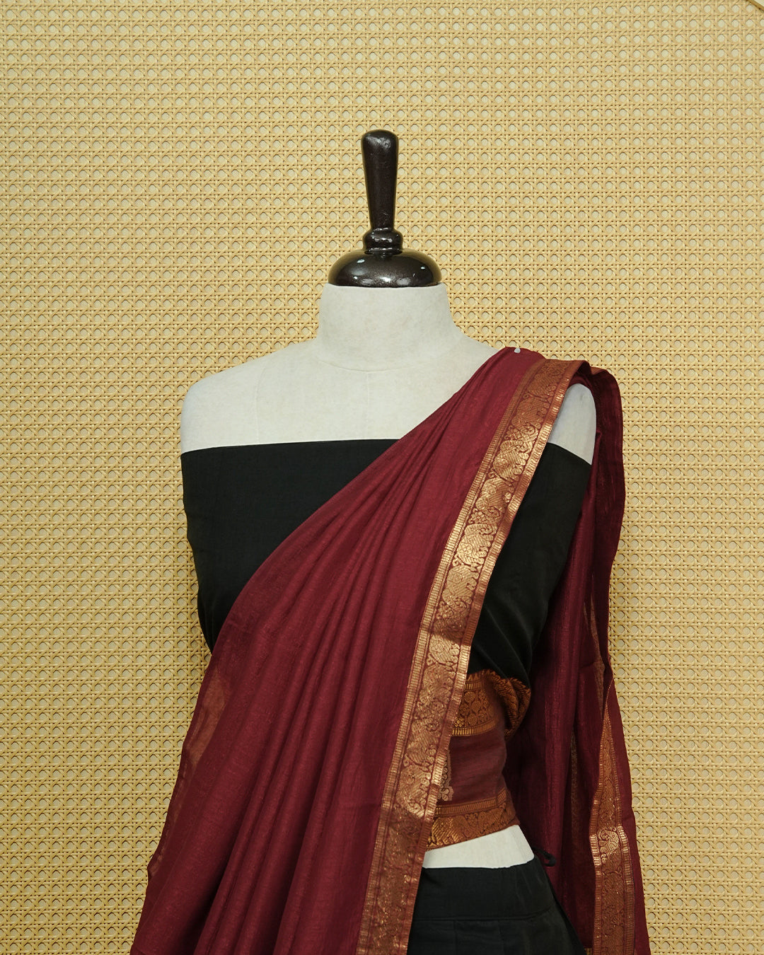 Black Colour chettinad cotton Semi stitched dhavani set featuring Contrast Maroon with Gold zari border skirt, comes with Matching blouse piece & dupatta.