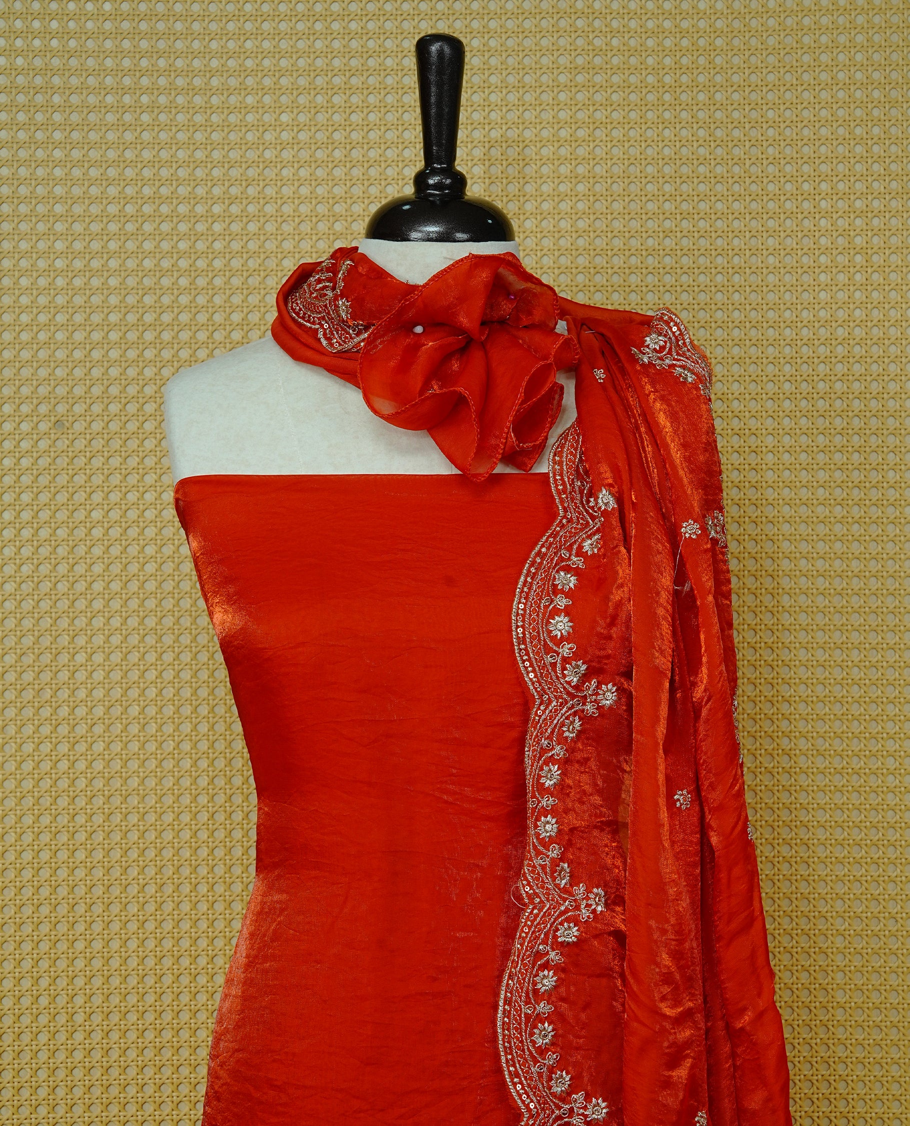 Orange colour Fendy silk salwar material With Elegant plain body with lining, Comes with santoon bottom, Fendy silk dupatta With Floral buttas & Scalp Border.